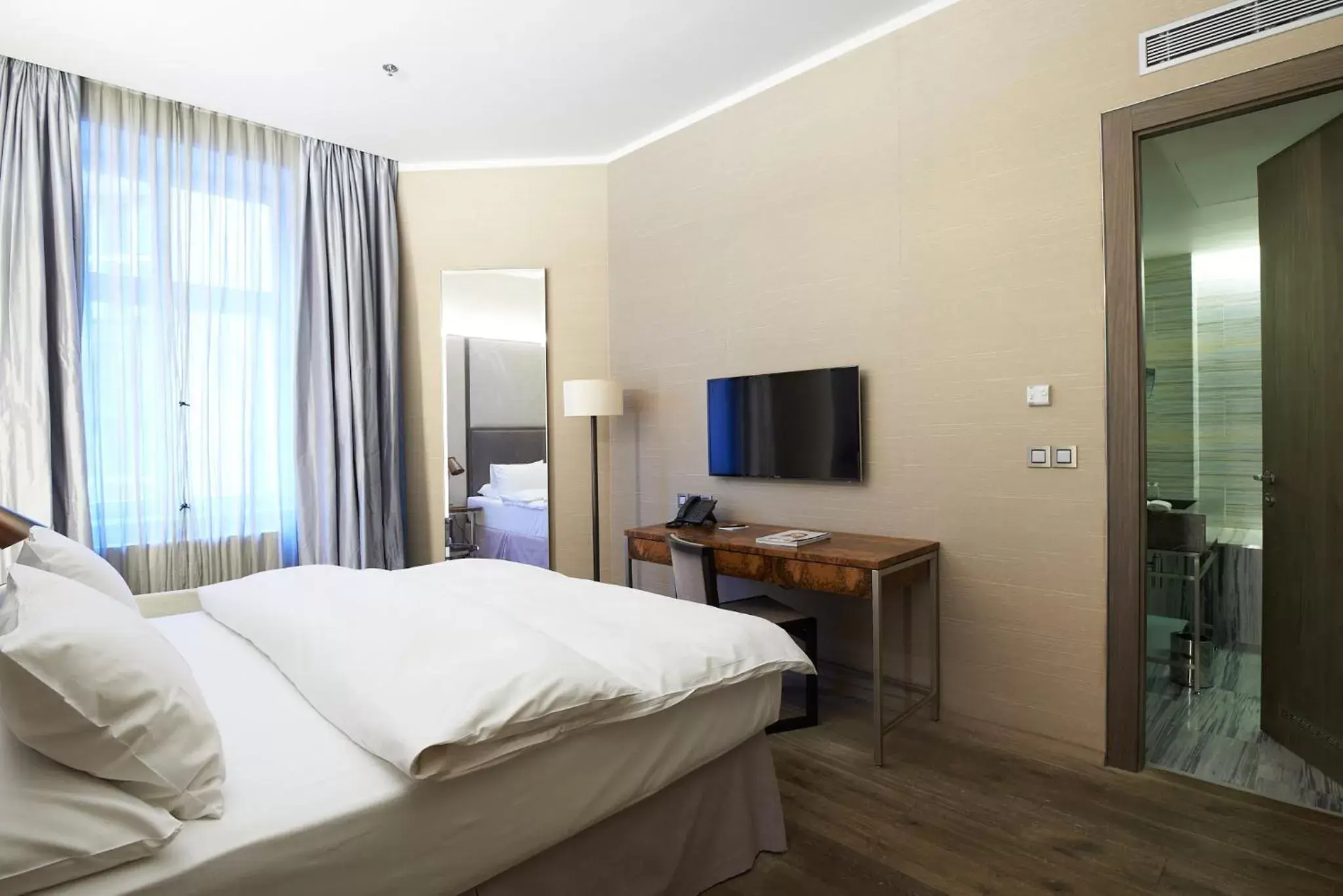 Bedroom, TV/Entertainment Center in The Emblem Prague Hotel - Preferred Hotels & Resorts