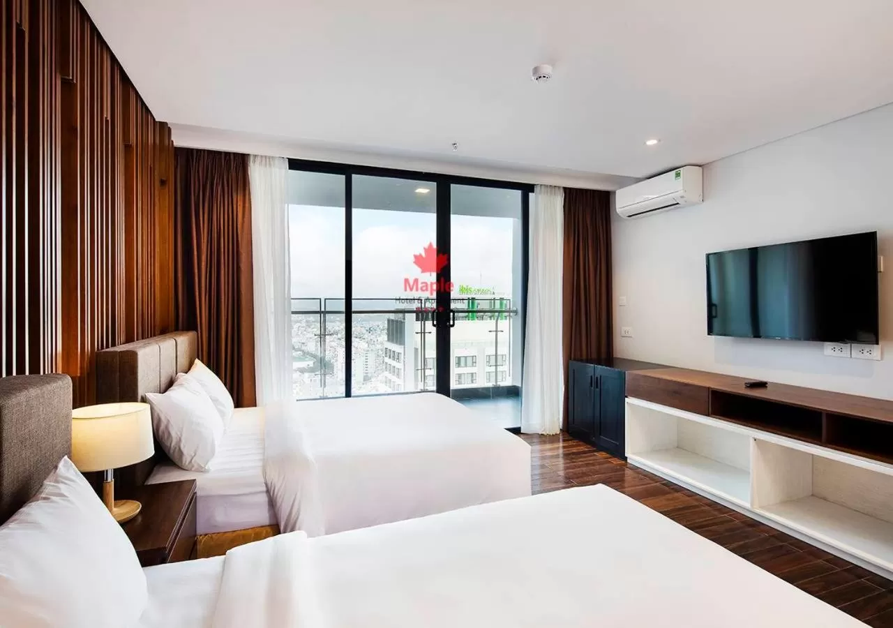 Bed in Maple Hotel & Apartment