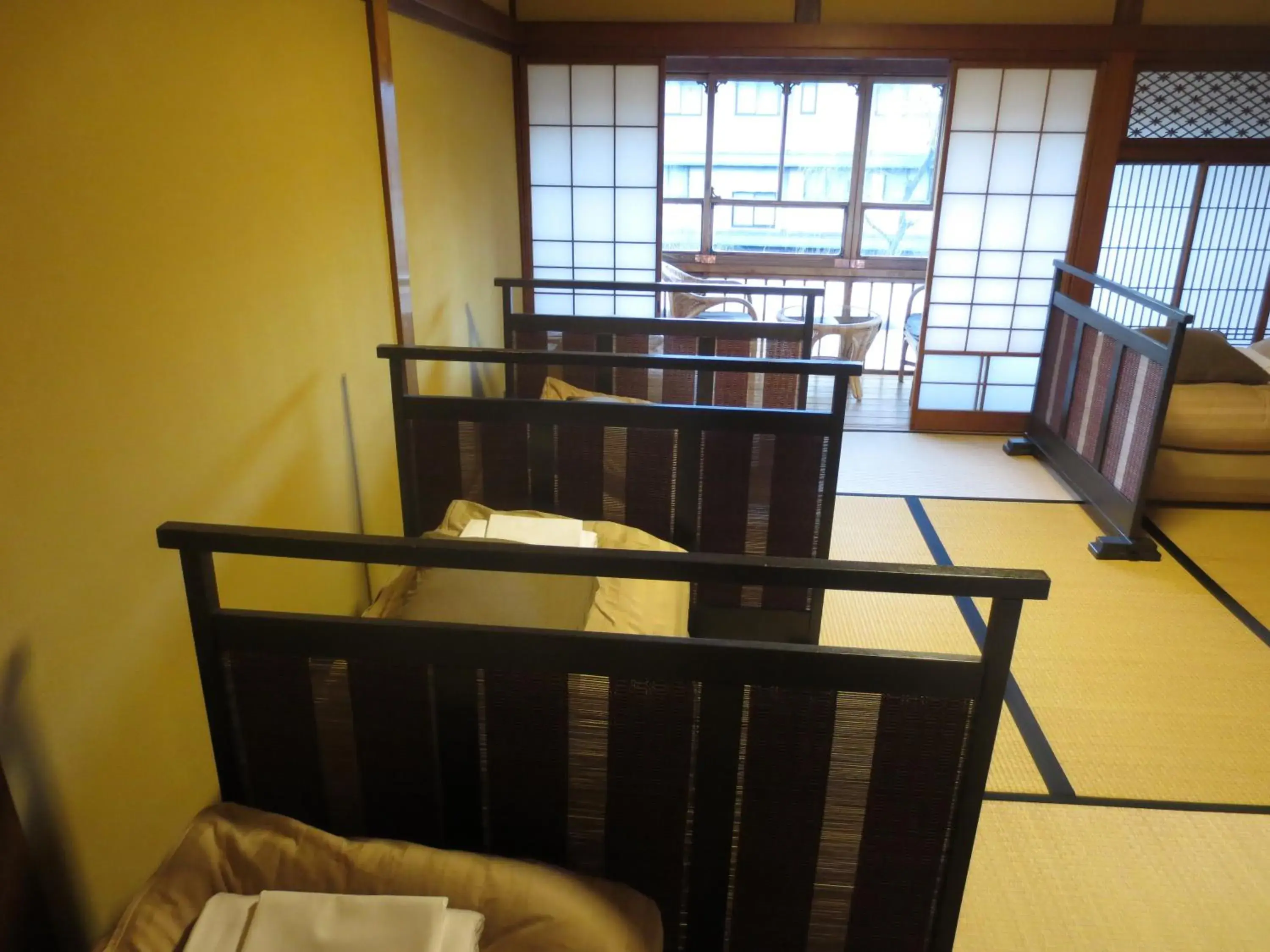 Bed, Dining Area in K's House Ito Onsen - Historical Ryokan Hostel