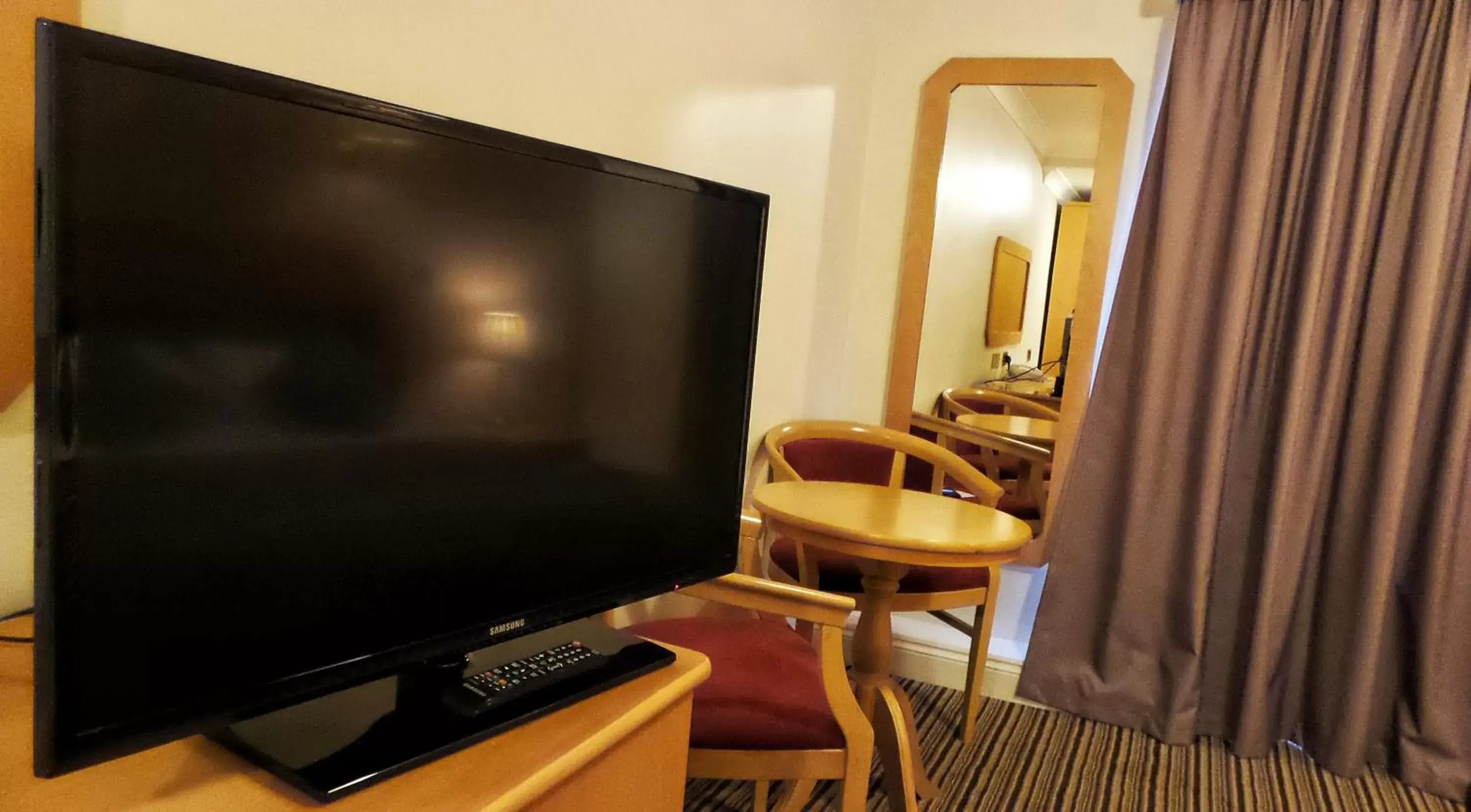 TV/Entertainment Center in Parkside International Hotel