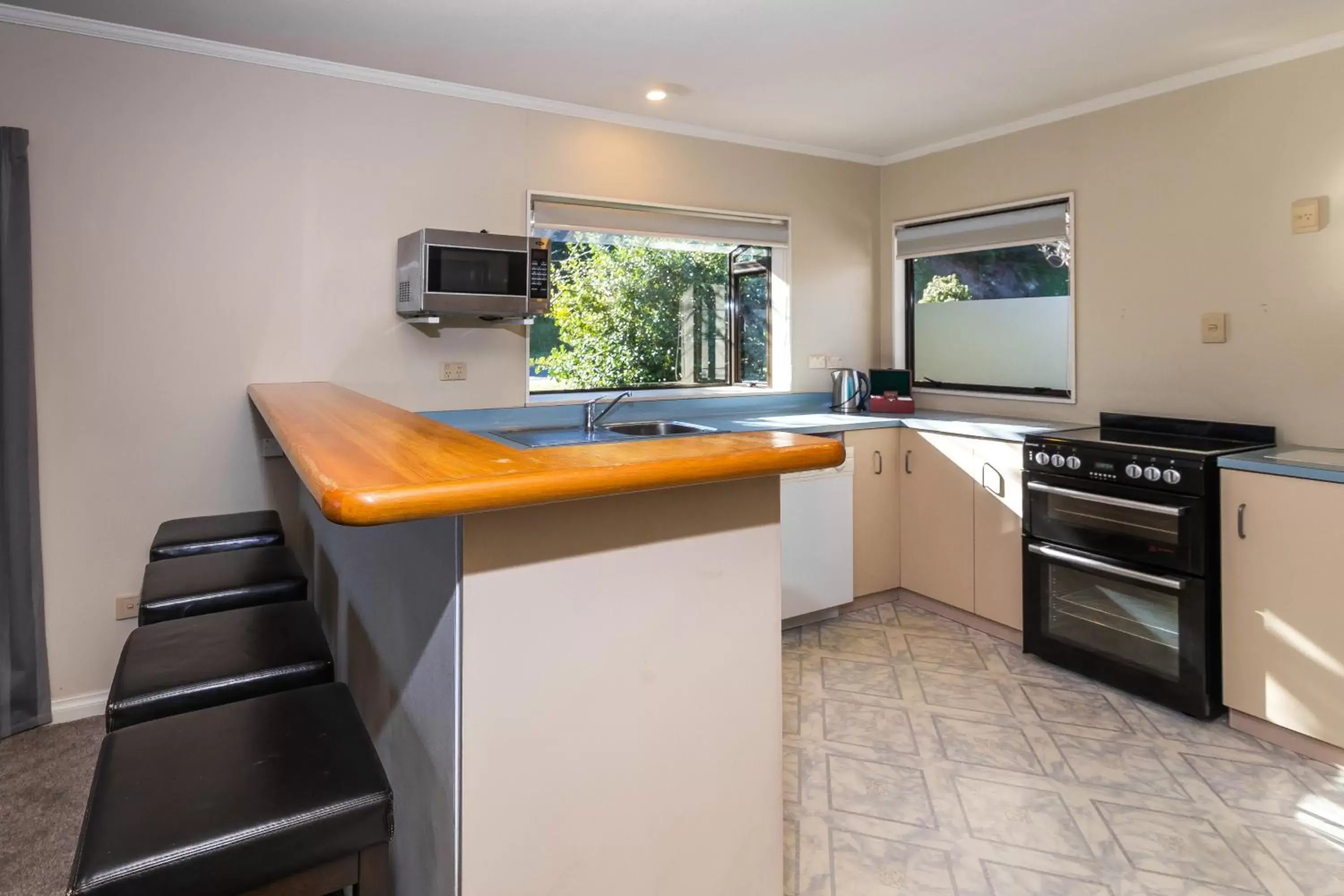 Kitchen or kitchenette, Kitchen/Kitchenette in Accent On Taupo Motor Lodge
