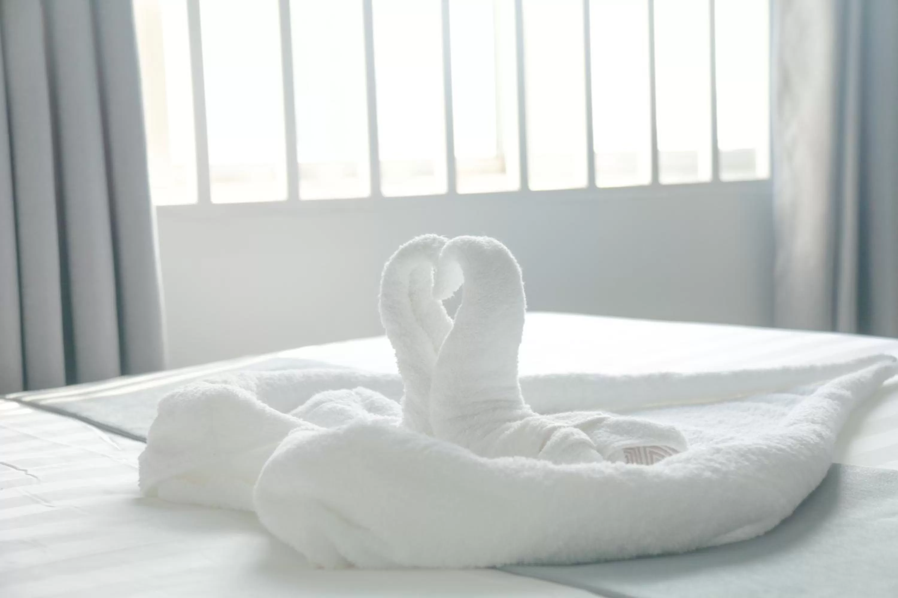 towels, Bed in White Corner Hotel