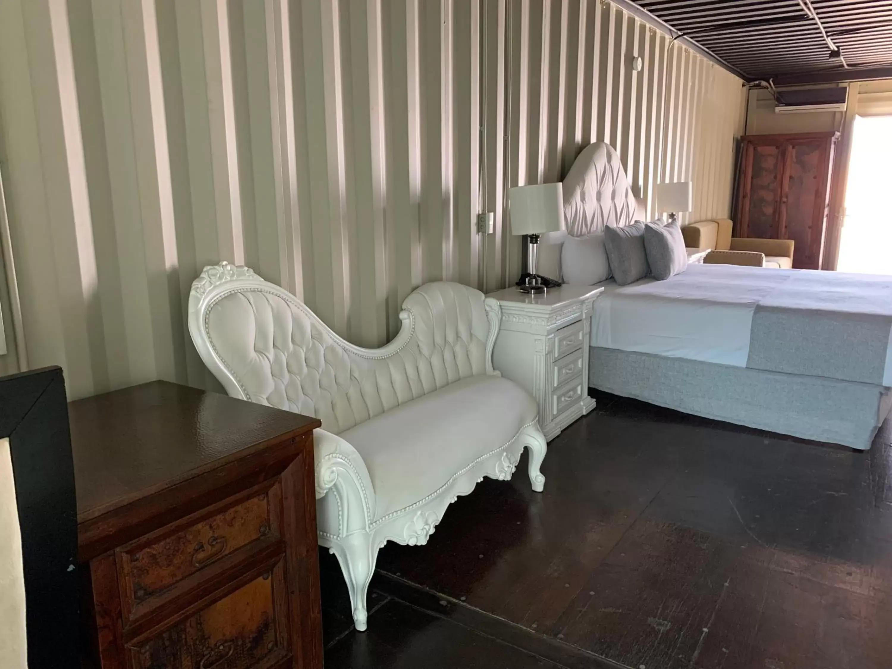 Bed, Seating Area in Container Inn