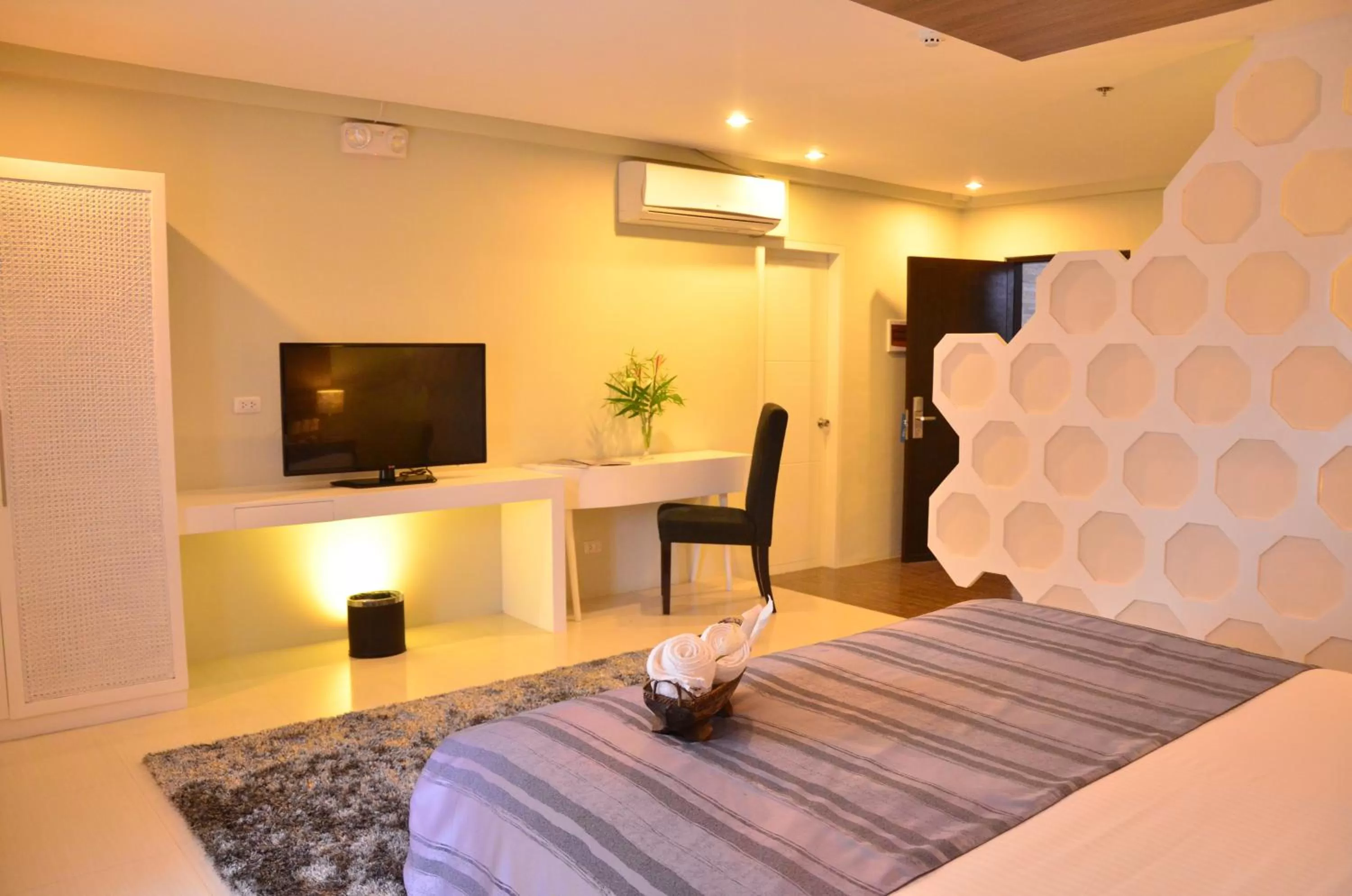Bed, TV/Entertainment Center in One Manalo Place