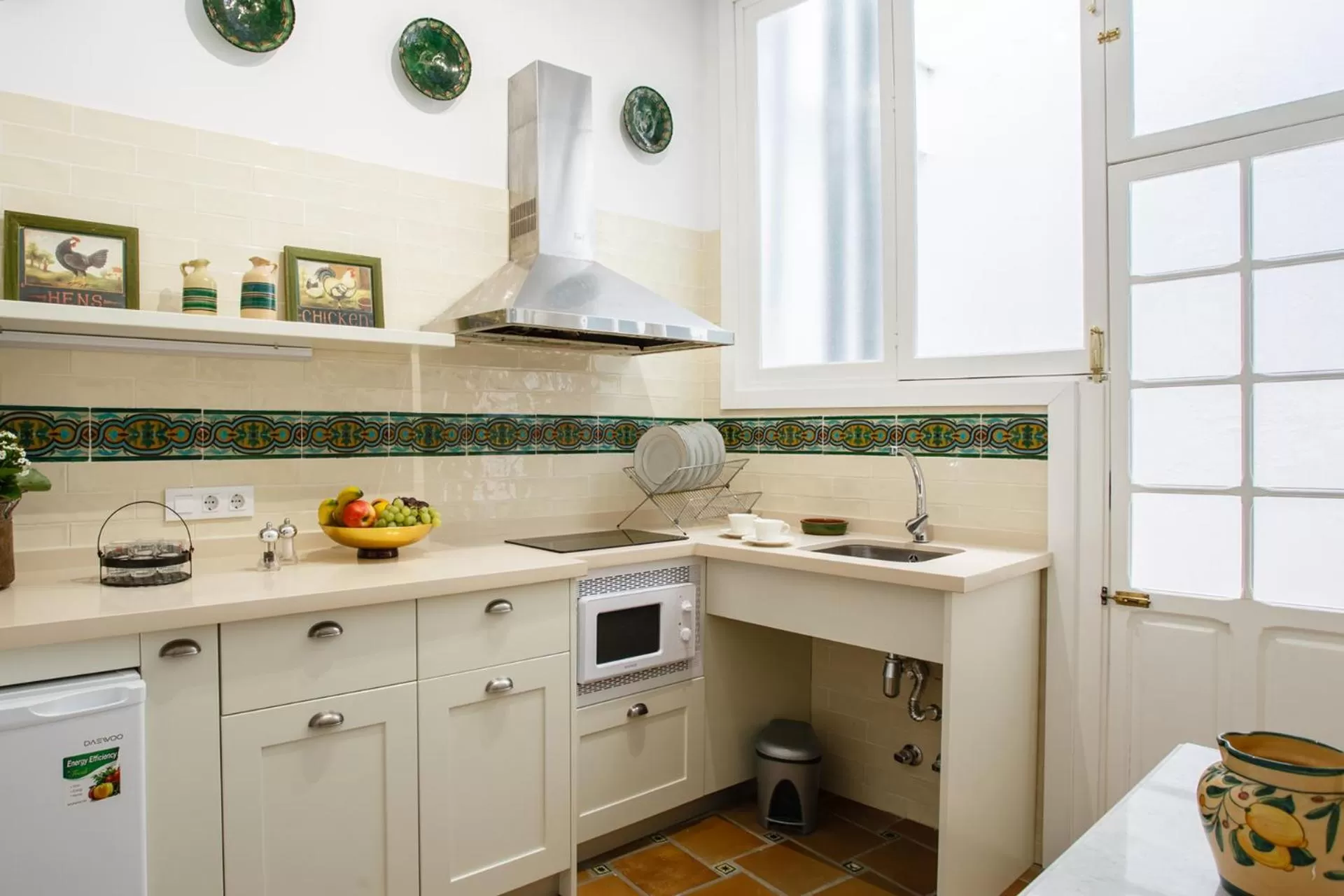Kitchen or kitchenette in Suites Machado