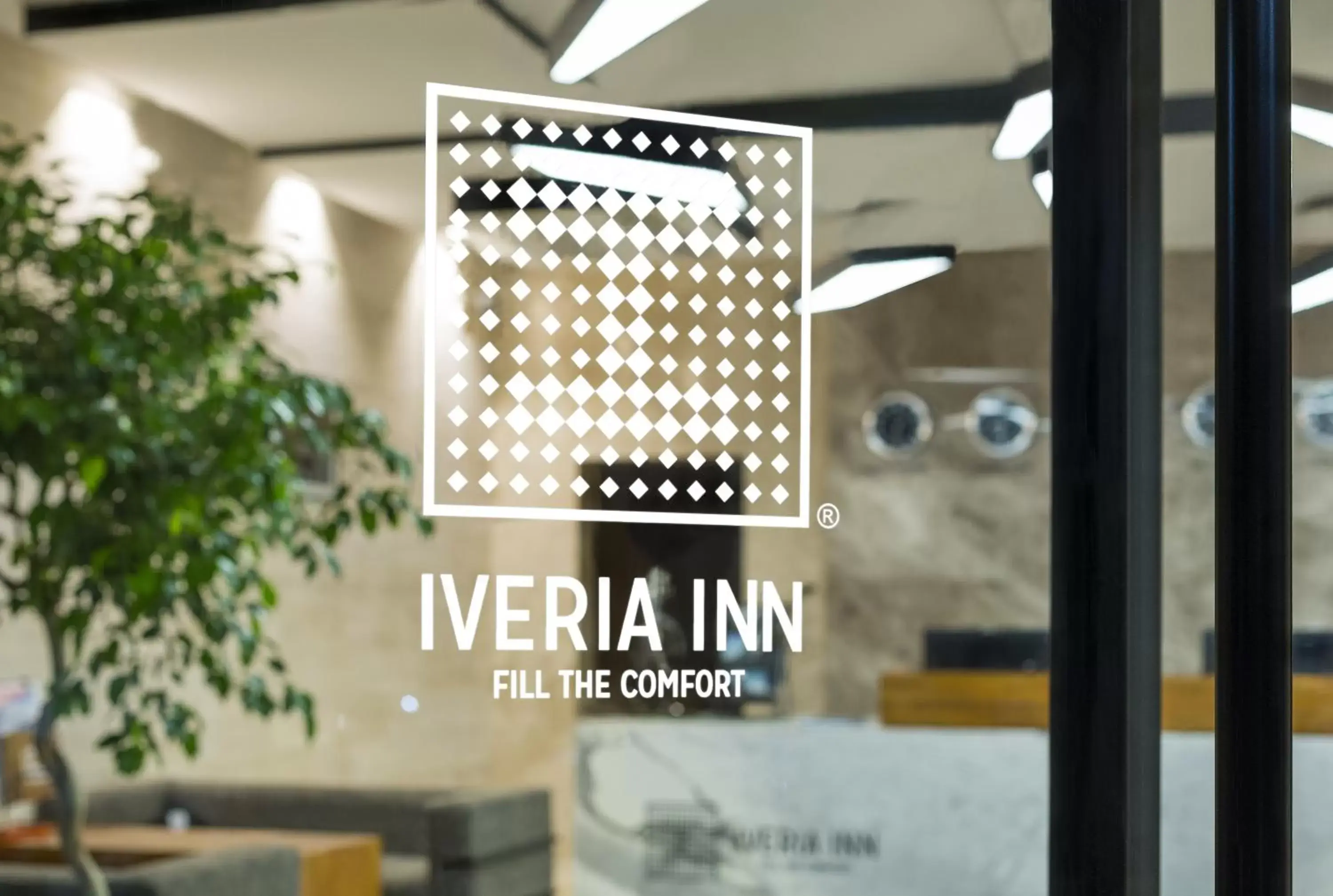 Property logo or sign in Iveria Inn Hotel