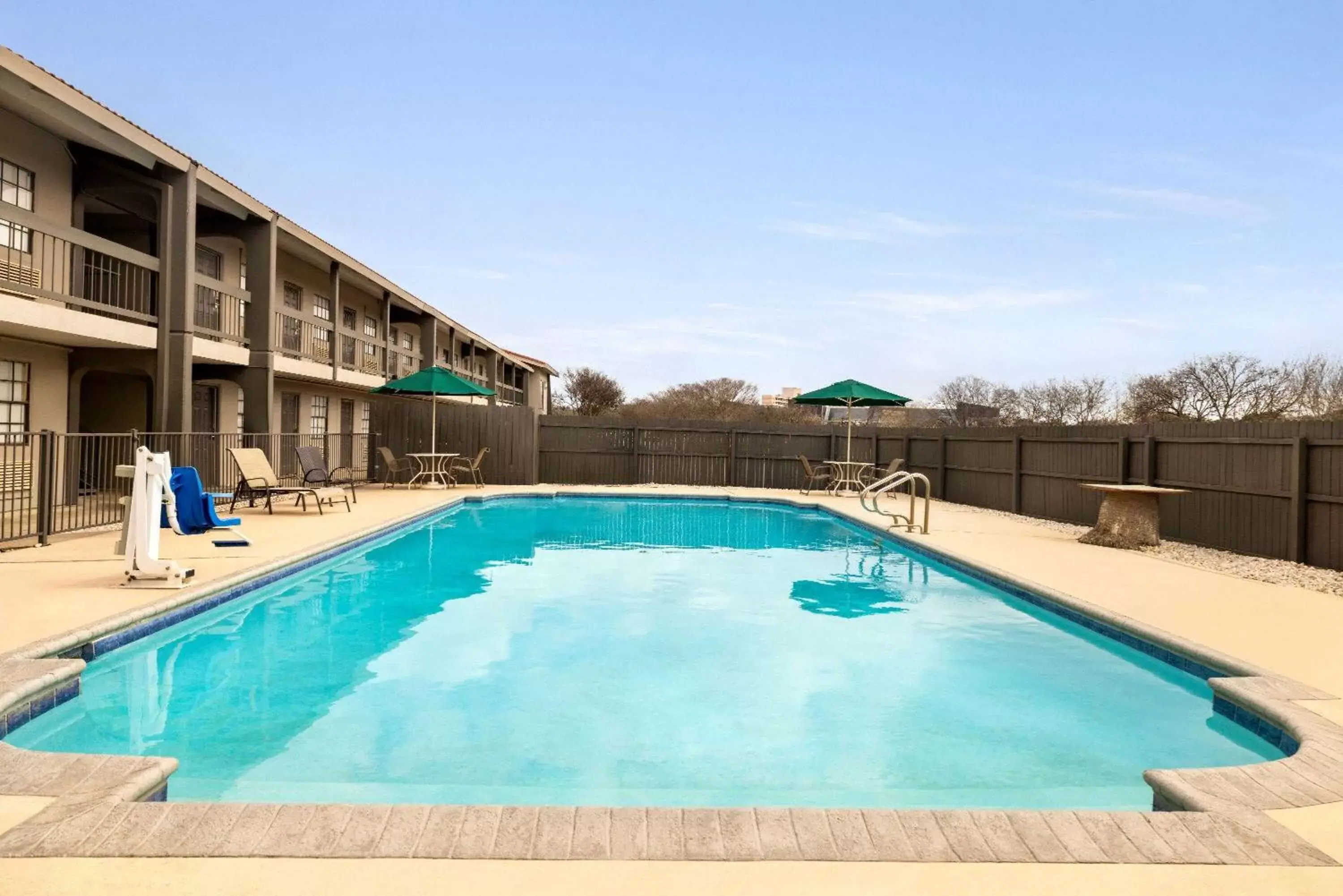 Property building, Swimming Pool in La Quinta Inn by Wyndham San Antonio Lackland