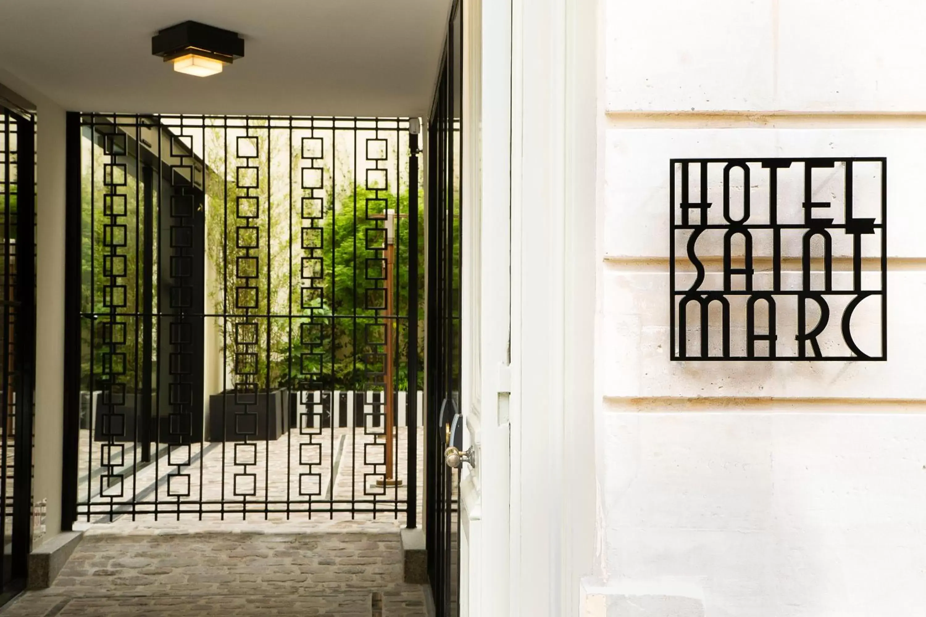 Property logo or sign, Patio/Outdoor Area in Hôtel Saint-Marc