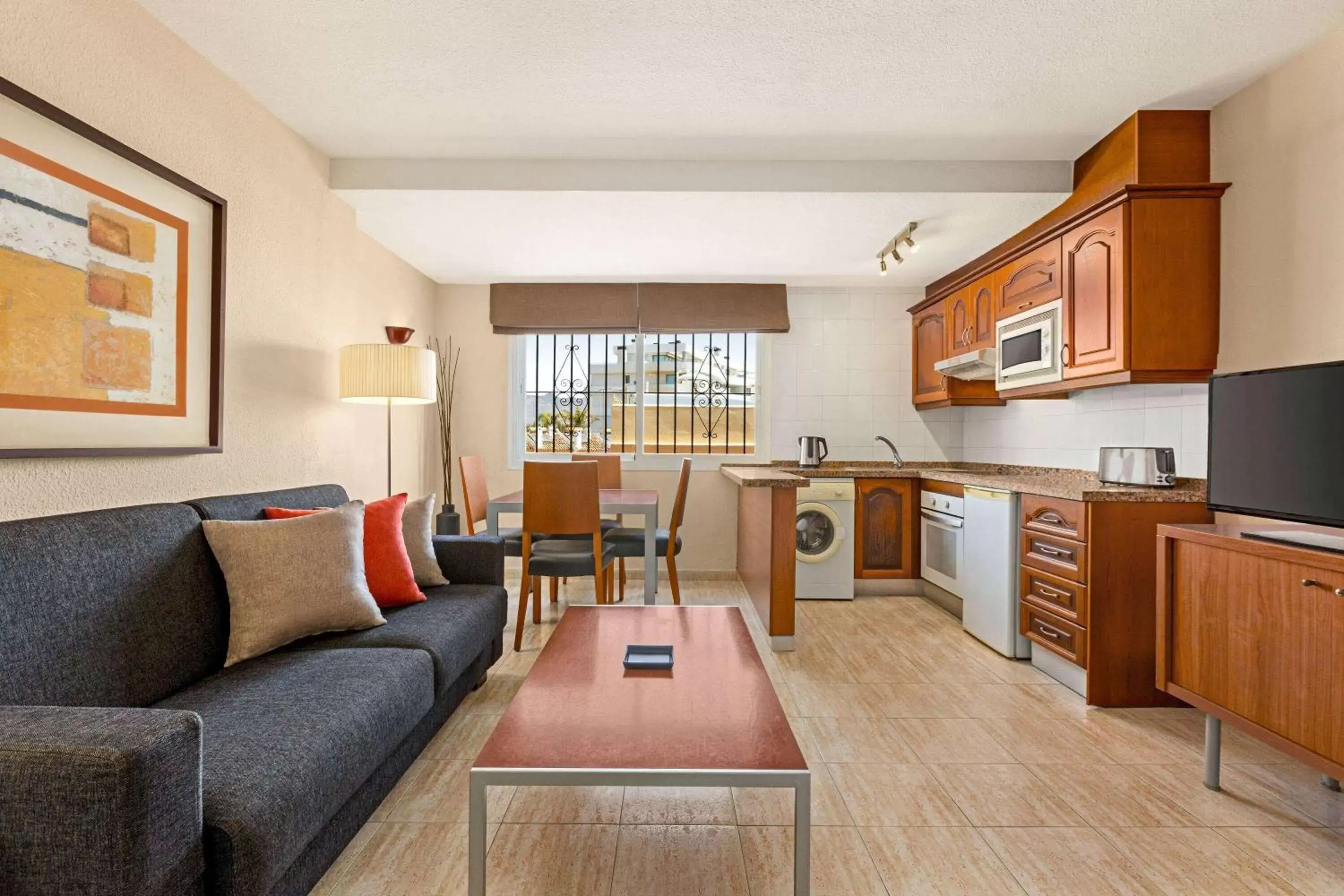 Kitchen or kitchenette, Seating Area in Ramada Hotel & Suites by Wyndham Costa del Sol