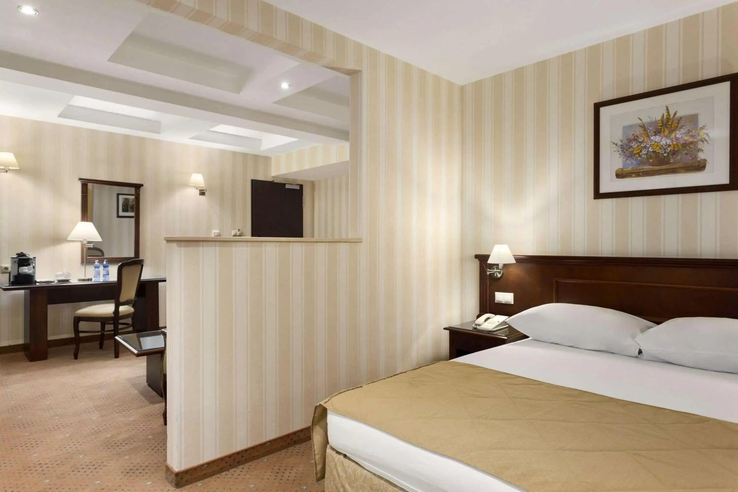 Photo of the whole room, Bed in Ramada Hotel & Suites by Wyndham Bucharest North