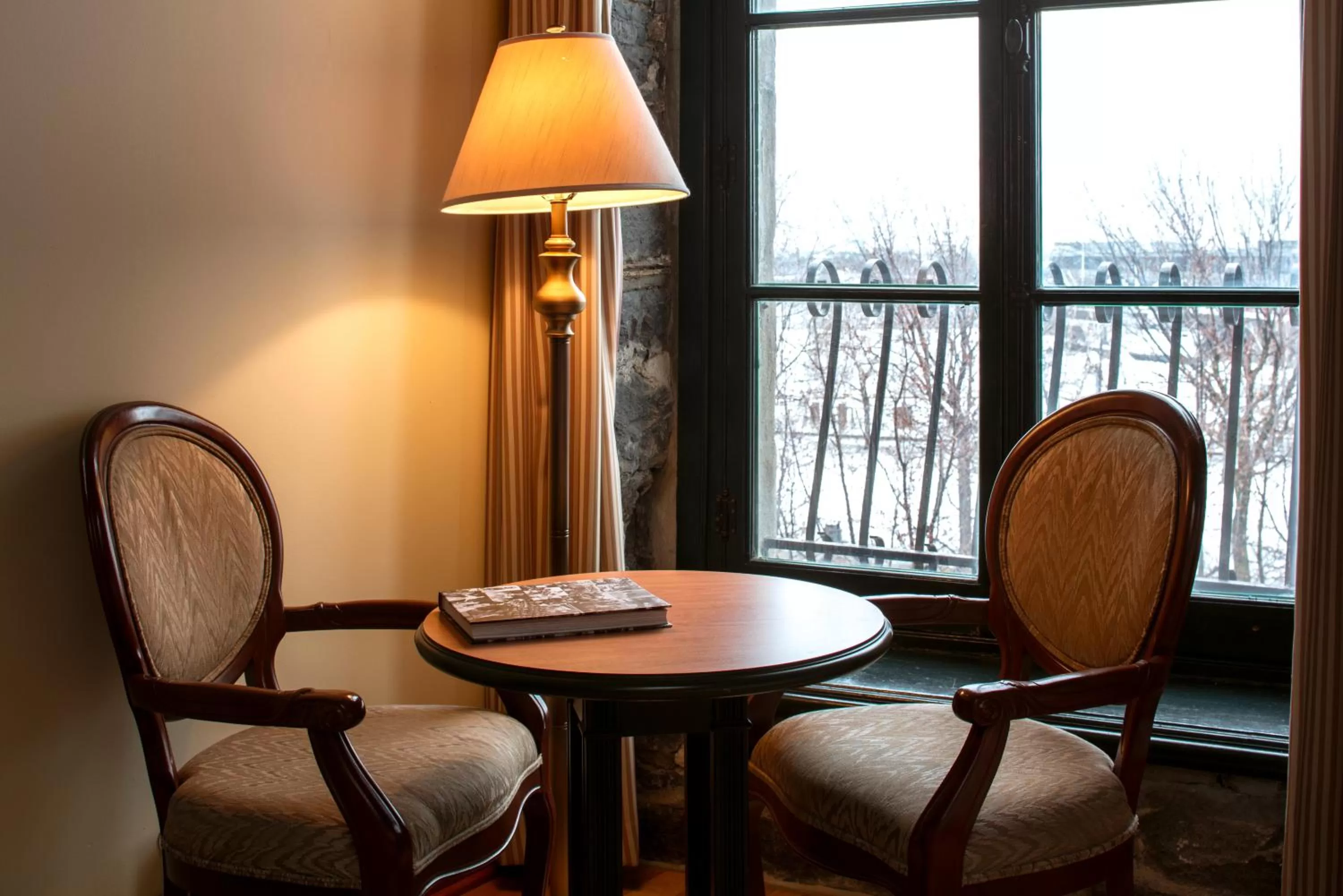 Seating area in Auberge du Vieux Port by Gray Collection