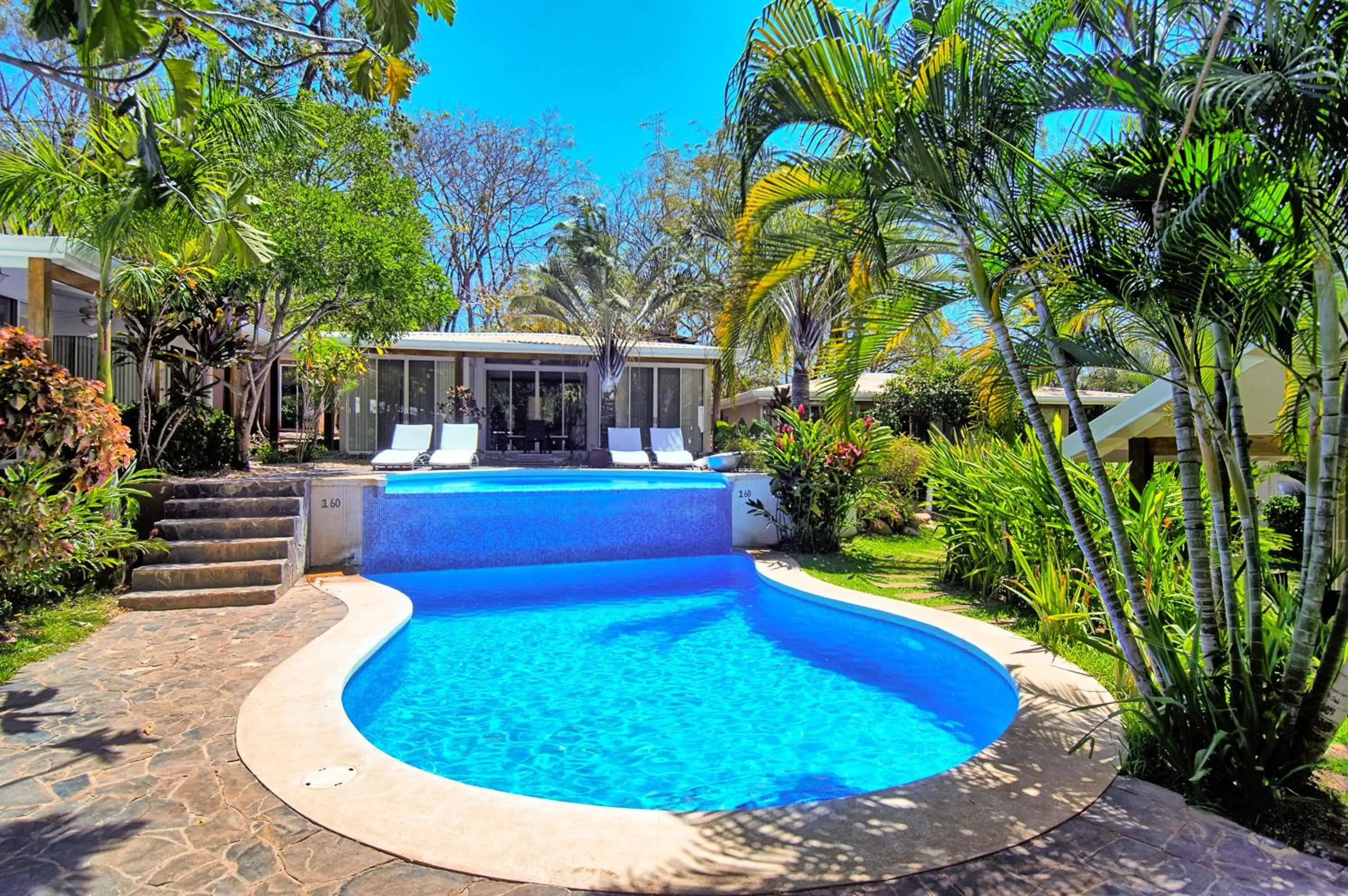 Garden, Swimming Pool in The Breeze Hotel & Villas