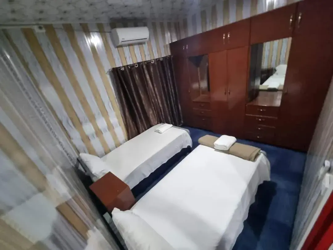 Bed in Al - Minhaj Service Apartments