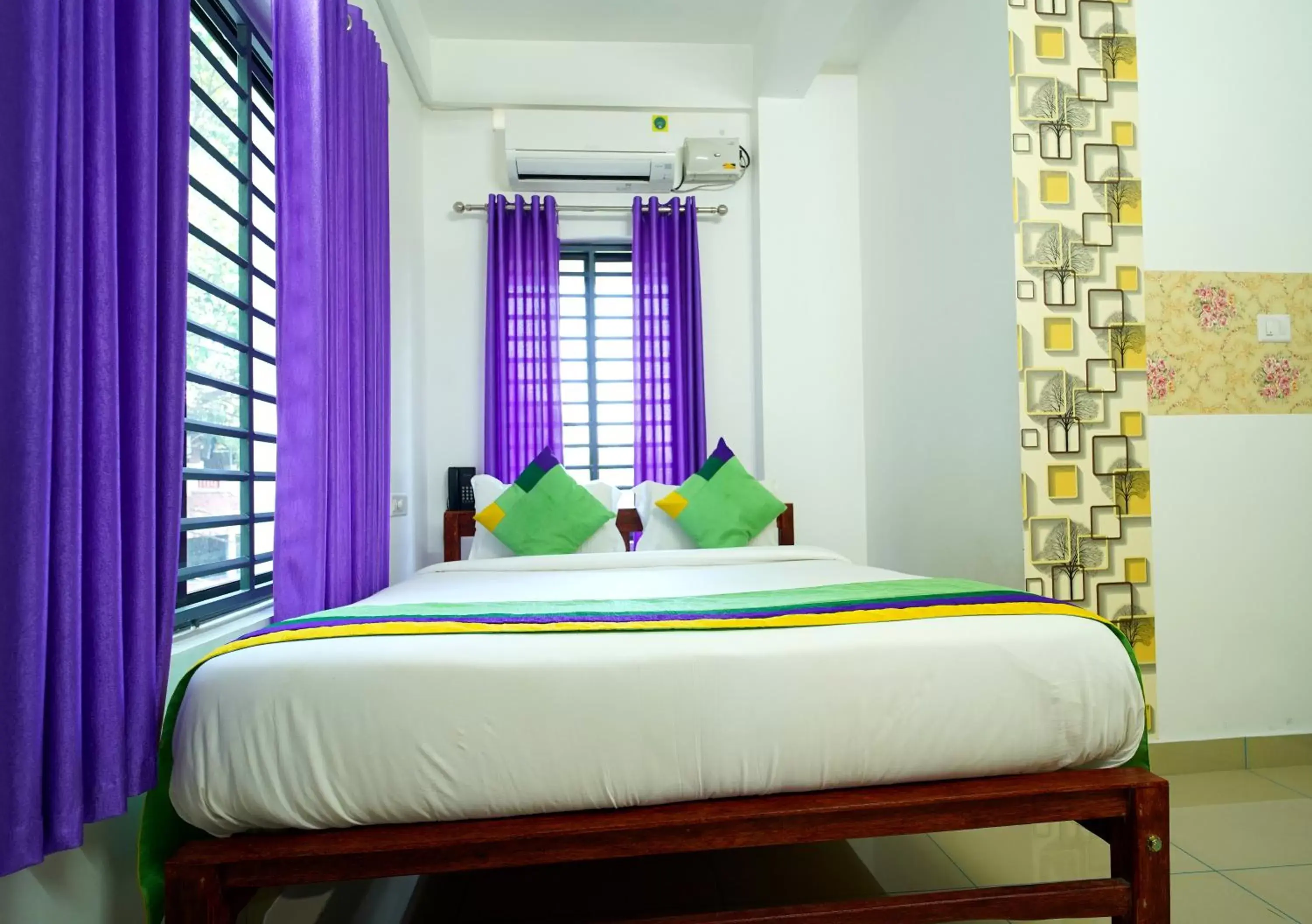 Bed in Treebo Trend Nirupama Apartment