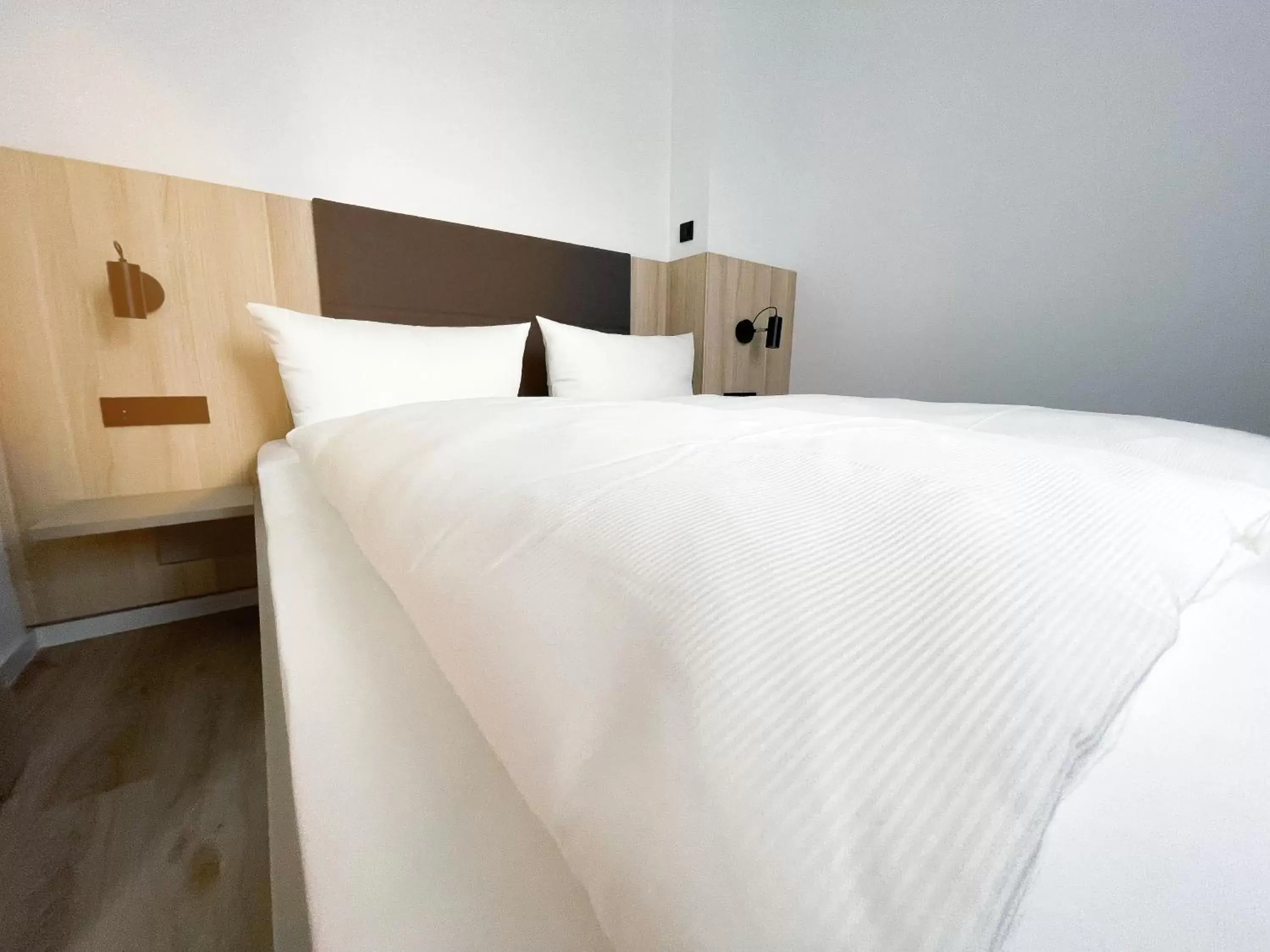 Bed in HOLI-Berlin Hotel