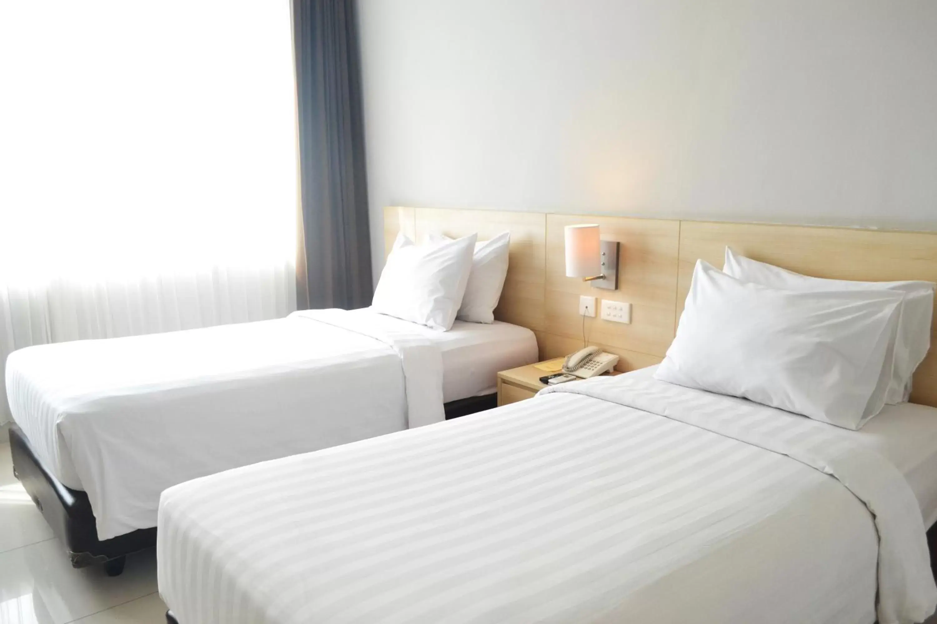 Bed in Grand Cakra Hotel Malang