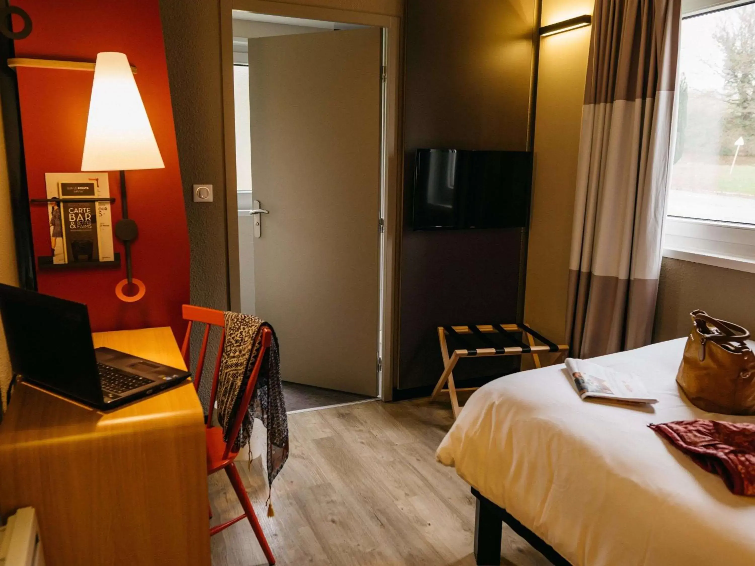 Photo of the whole room, TV/Entertainment Center in ibis Quimper