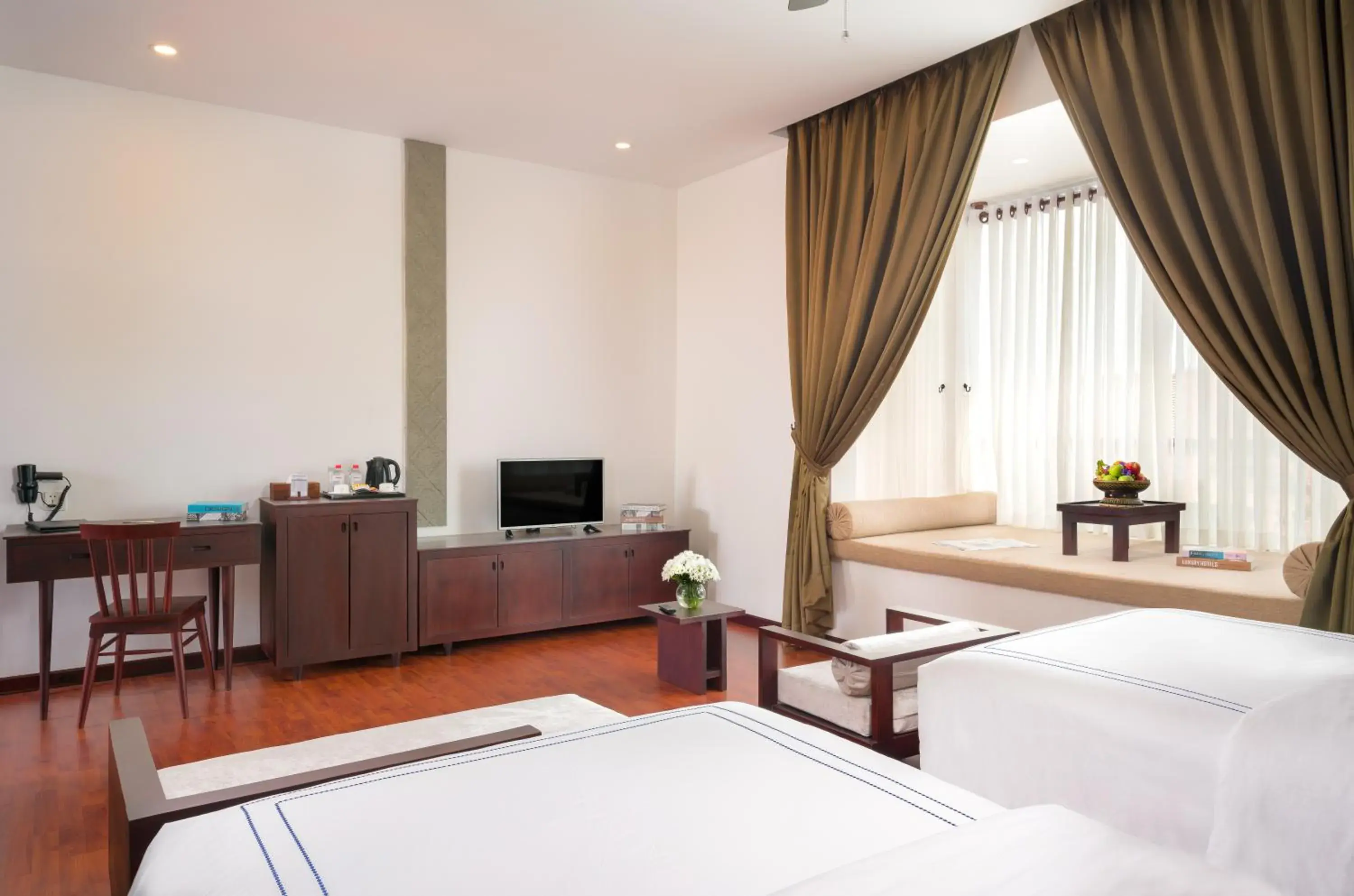 Bed, TV/Entertainment Center in The Embassy Angkor Resort & Spa