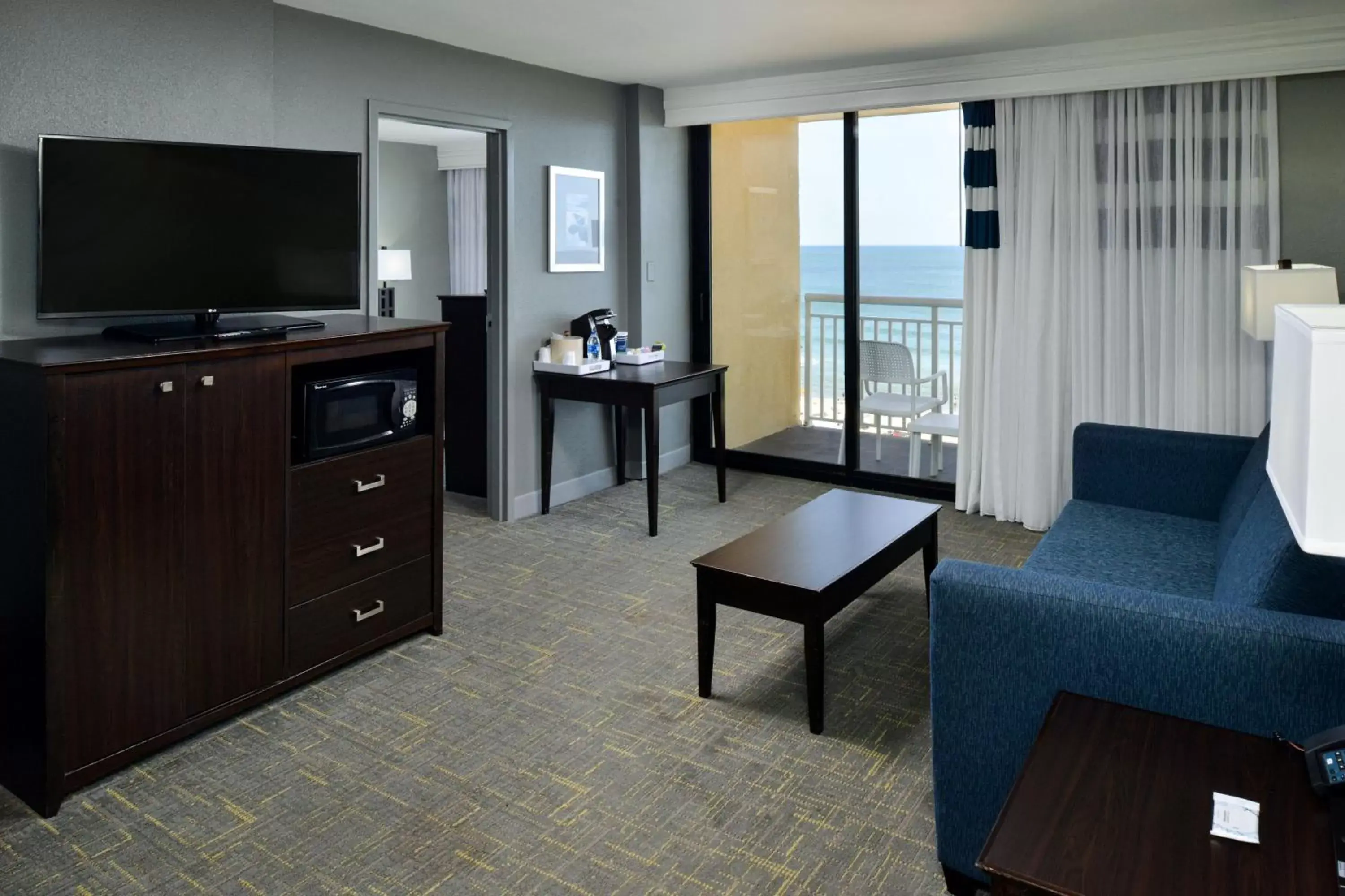 Photo of the whole room, TV/Entertainment Center in Four Points by Sheraton Virginia Beach Oceanfront