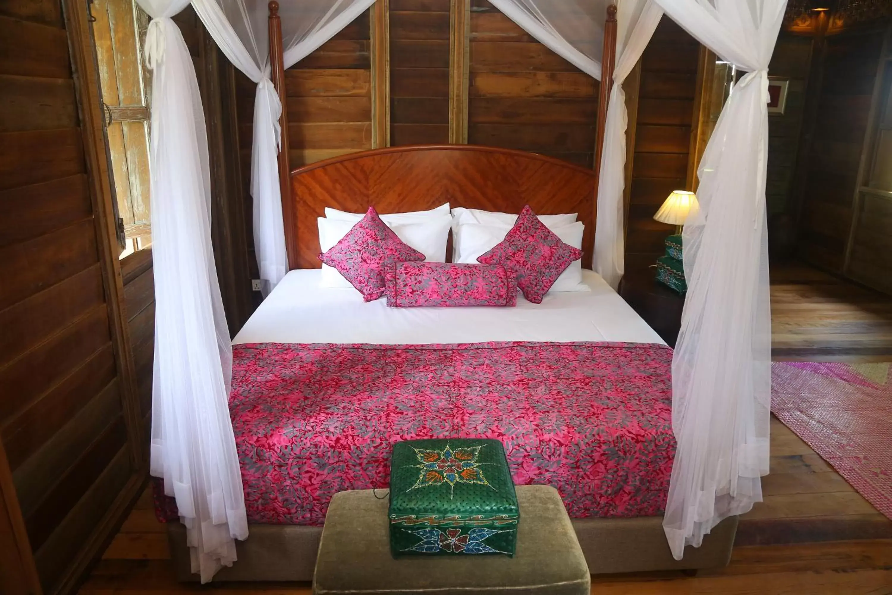 Bed in Kunang Kunang Heritage Villas