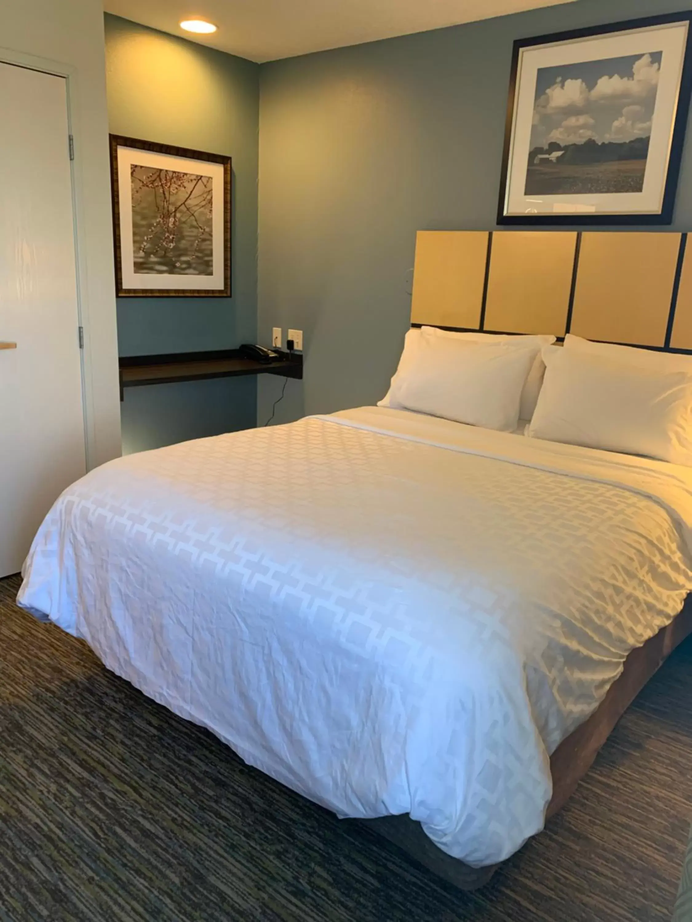 Bed in Candlewood Suites Fargo-North Dakota State University, an IHG Hotel