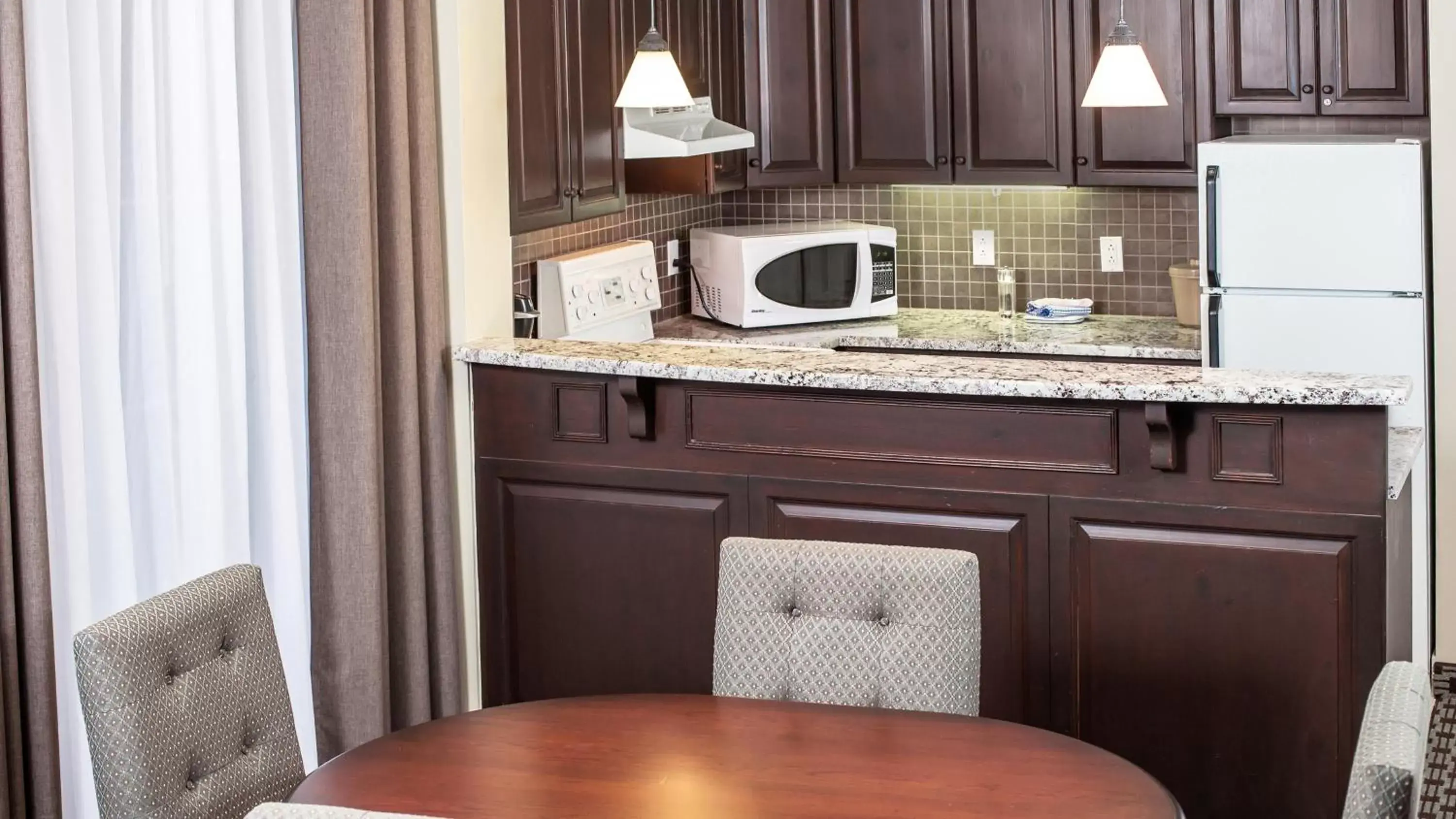 Photo of the whole room, Kitchen/Kitchenette in Holiday Inn Express & Suites Tremblant, an IHG Hotel