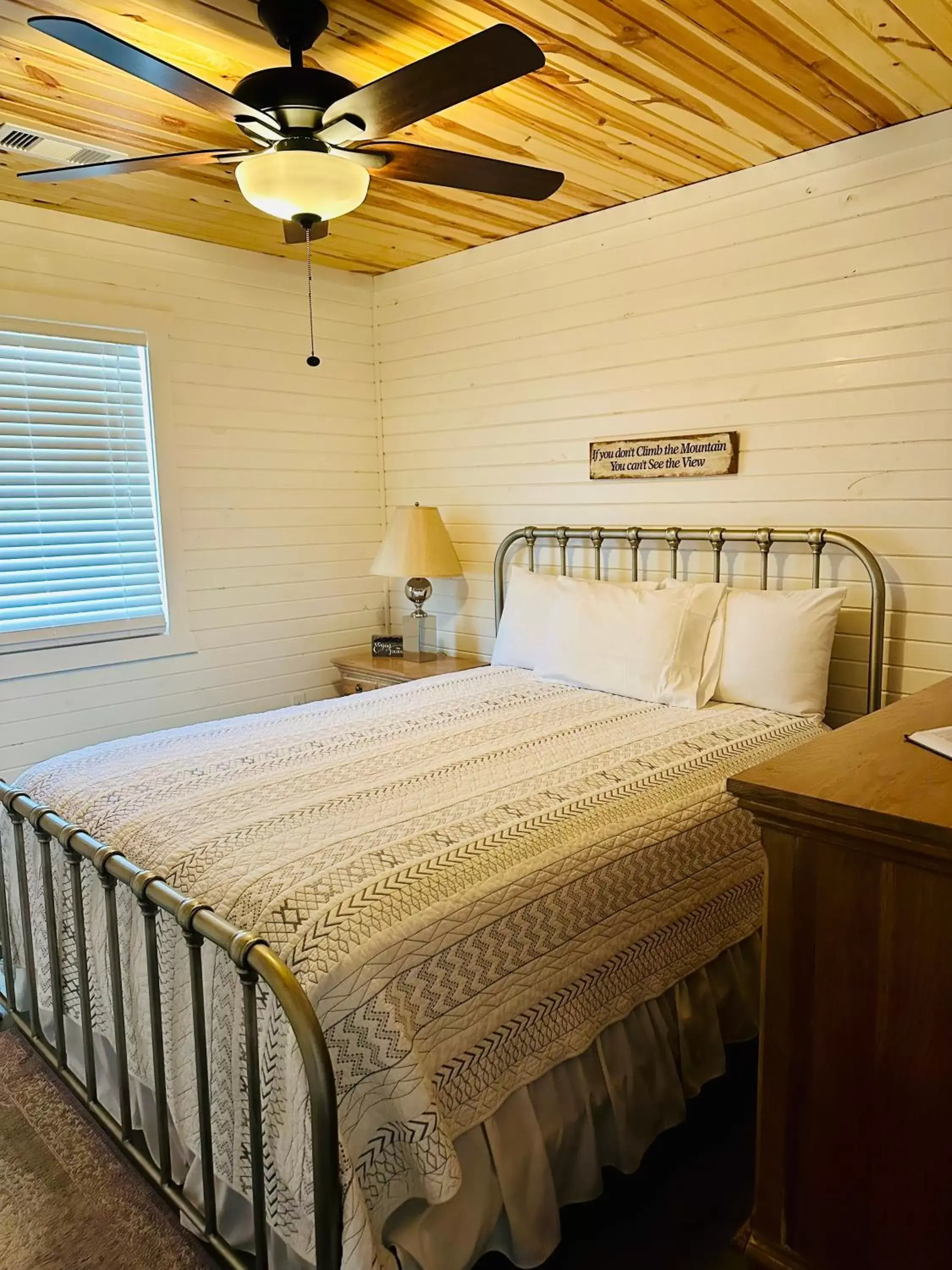 Bed in Knotty Squirrel Cabins