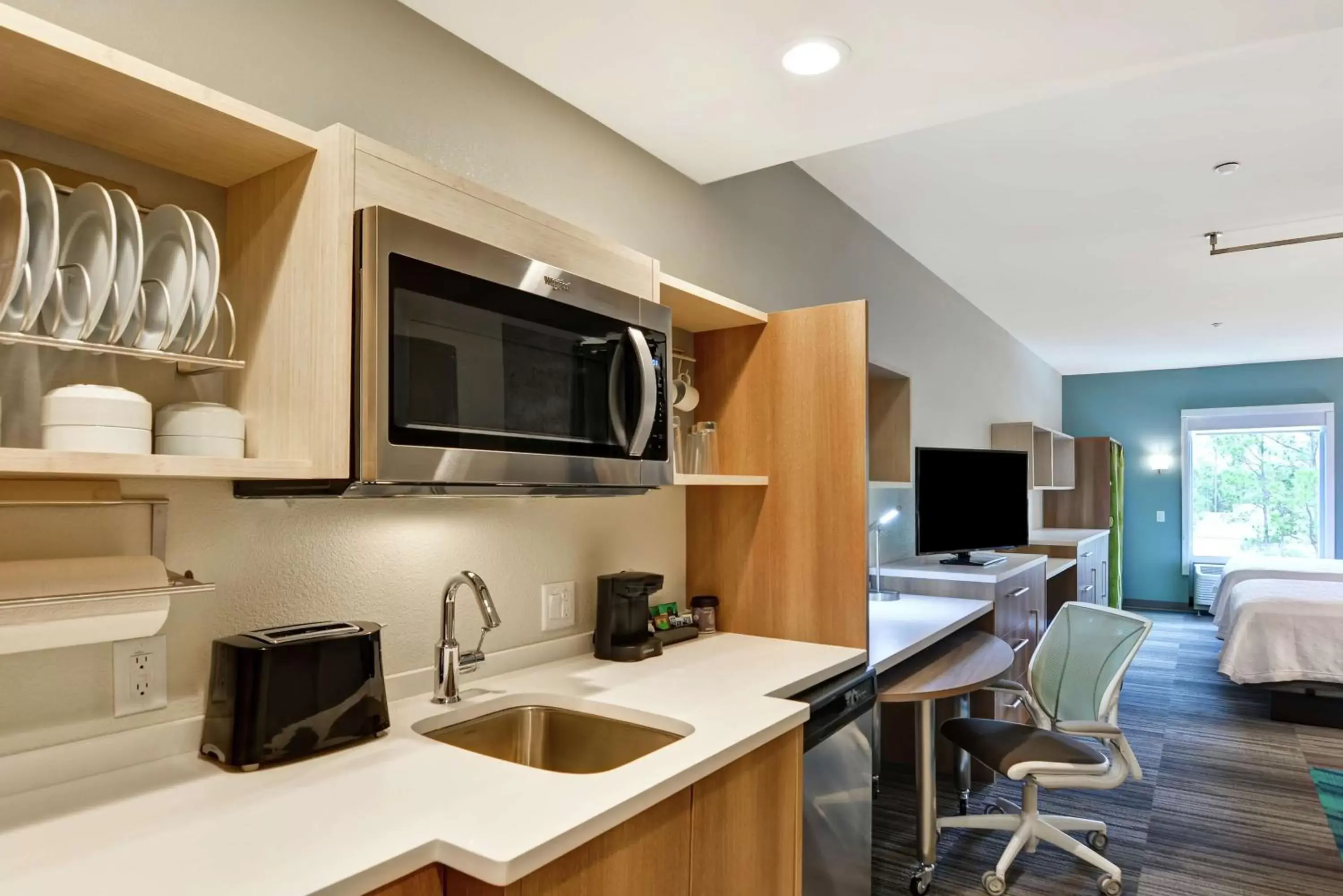 Bedroom, Kitchen/Kitchenette in Home2 Suites By Hilton Daytona Beach Speedway