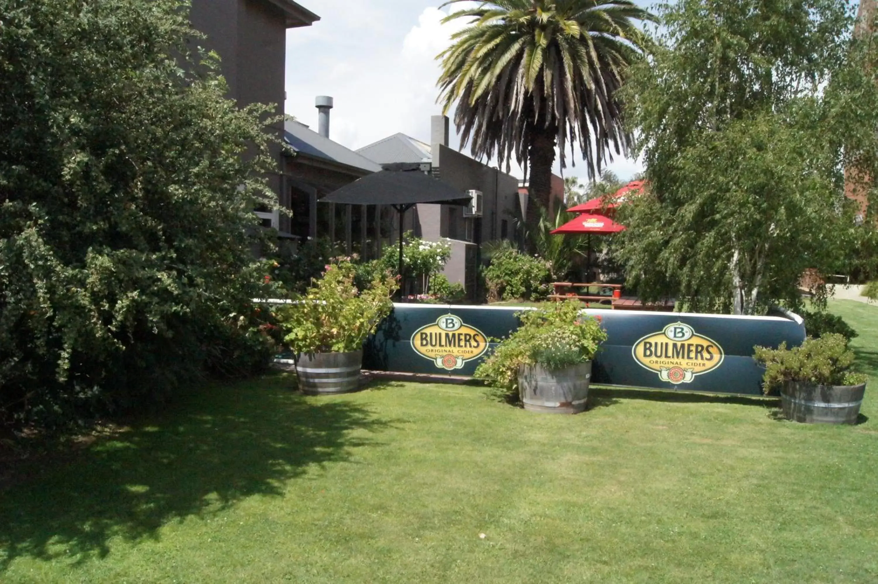 Property building, Garden in Burkes Hotel Motel