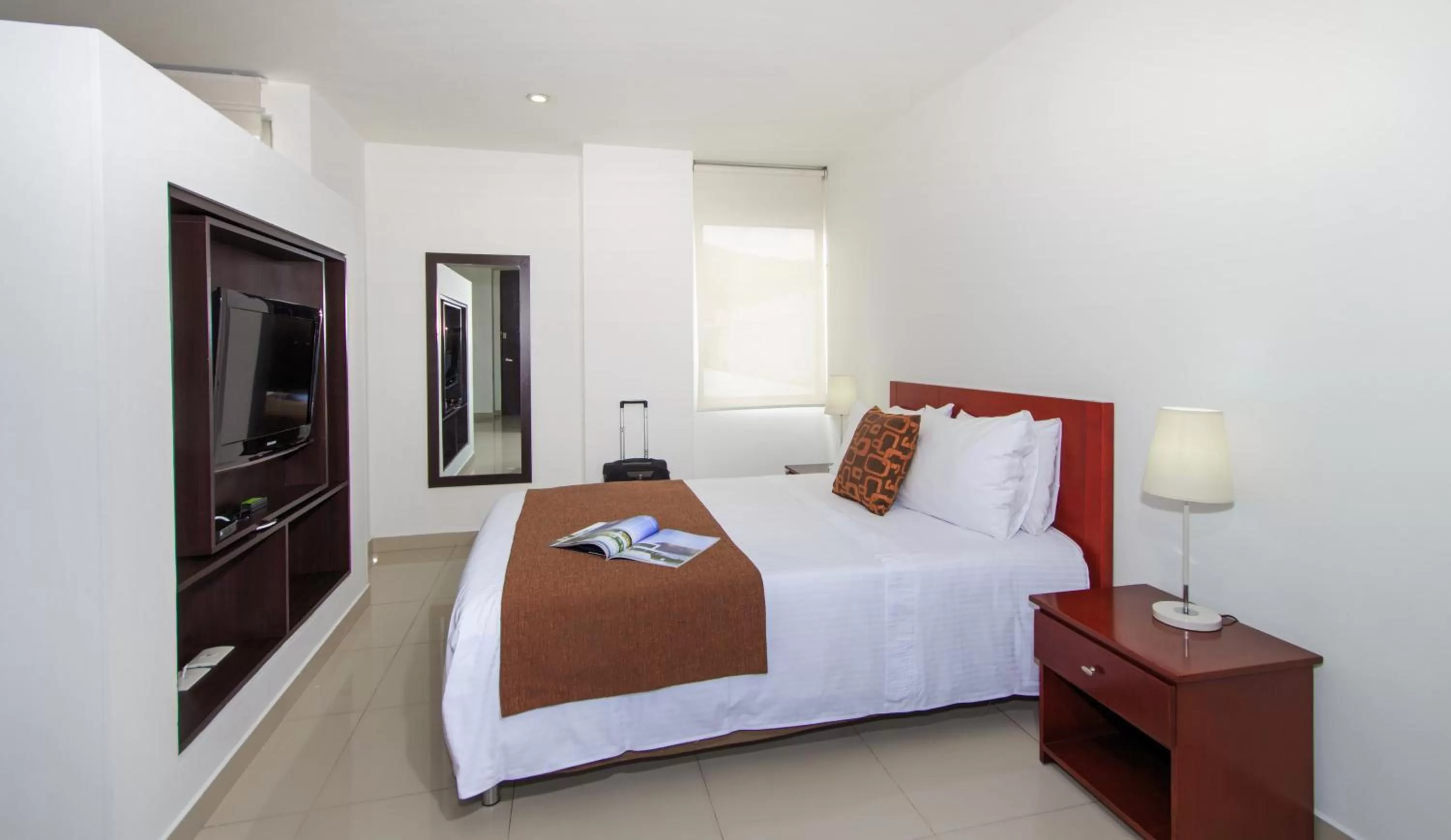 Bed in 122 Plaza Apartahotel