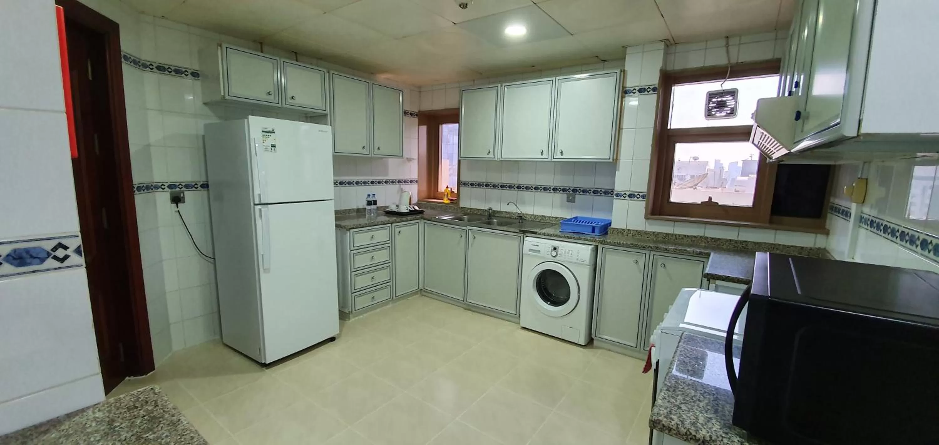 Kitchen or kitchenette in Ivory Hotel Apartments