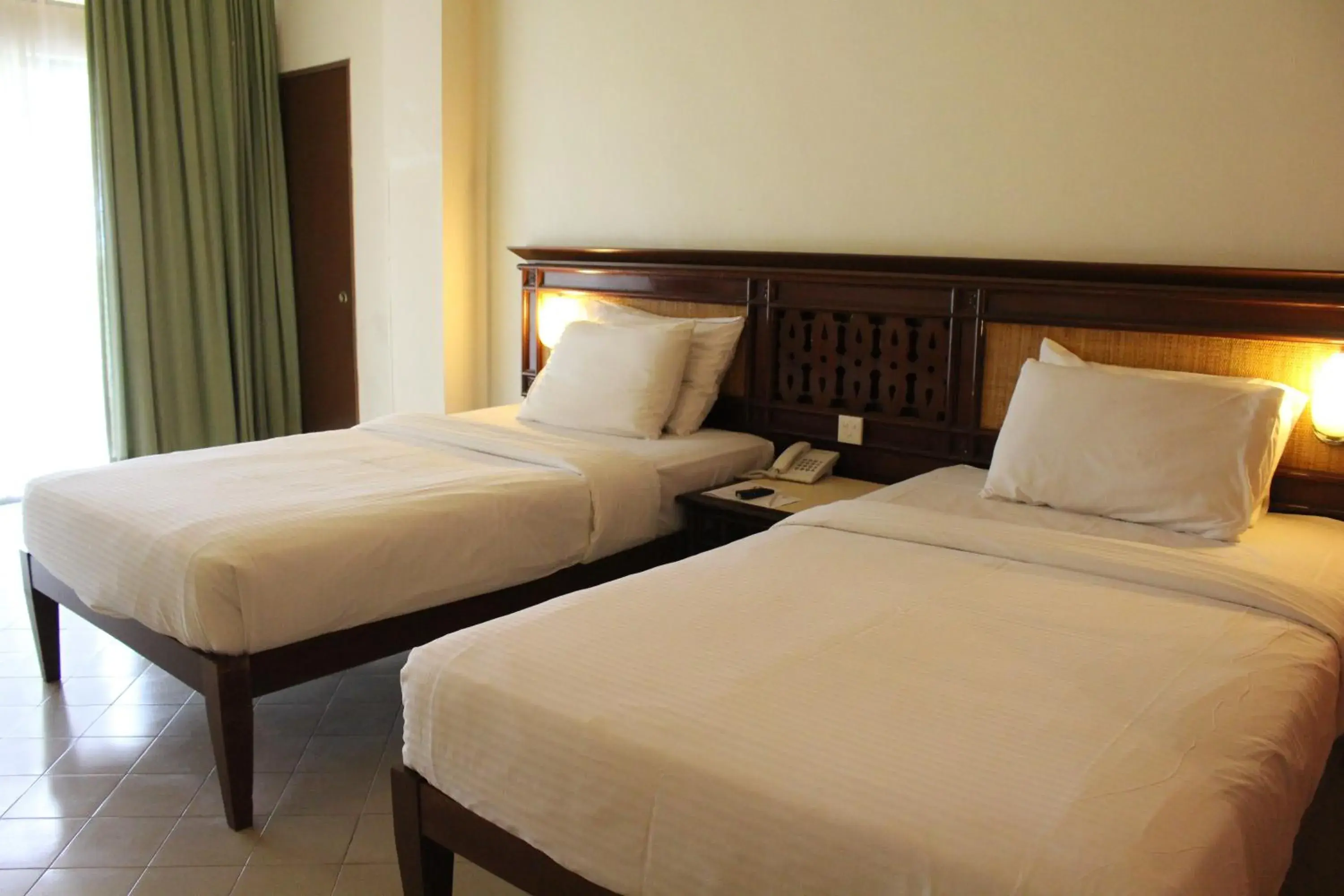 Bed in Primula Beach Hotel