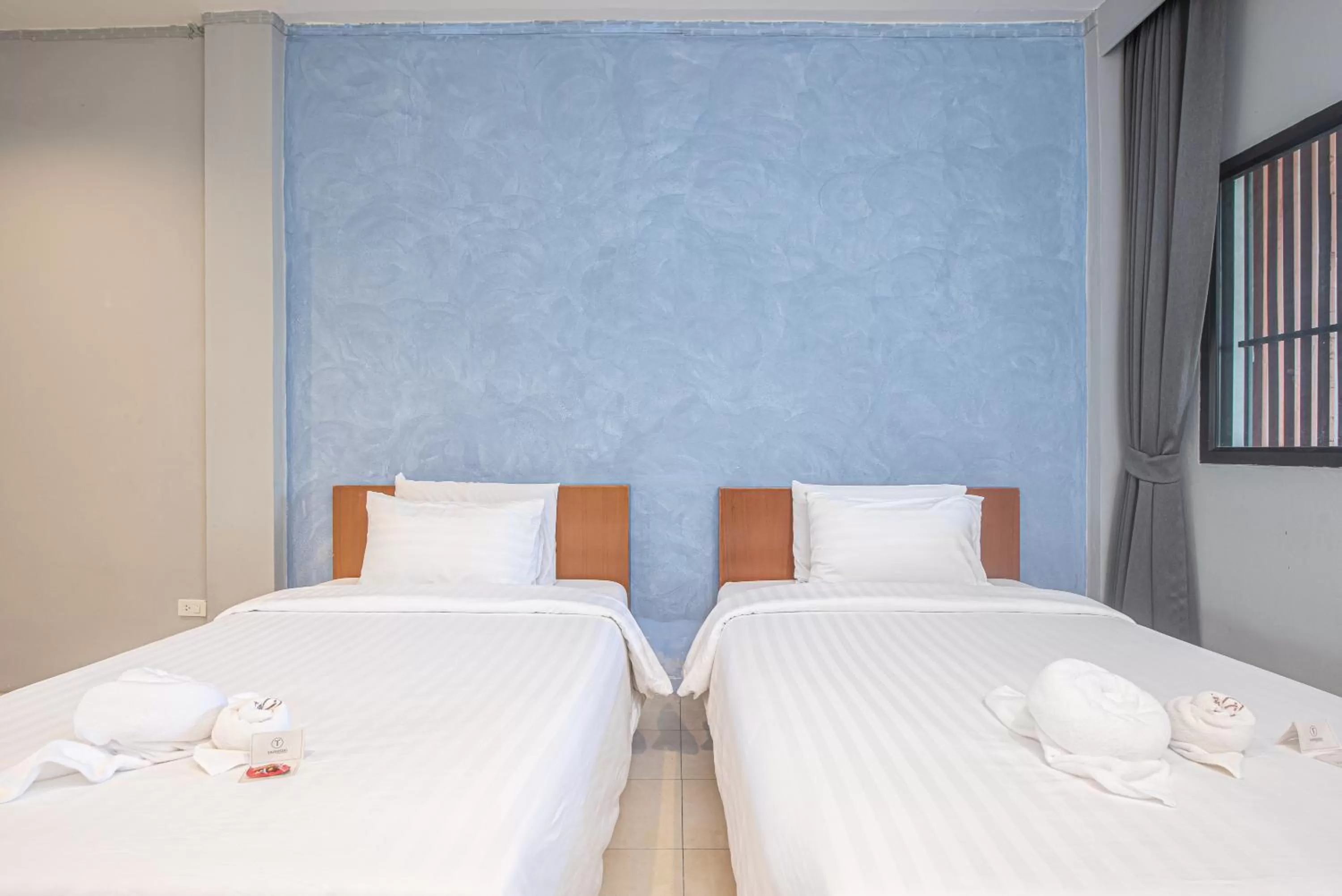 Bed in Tarnsiri Boutique Resort