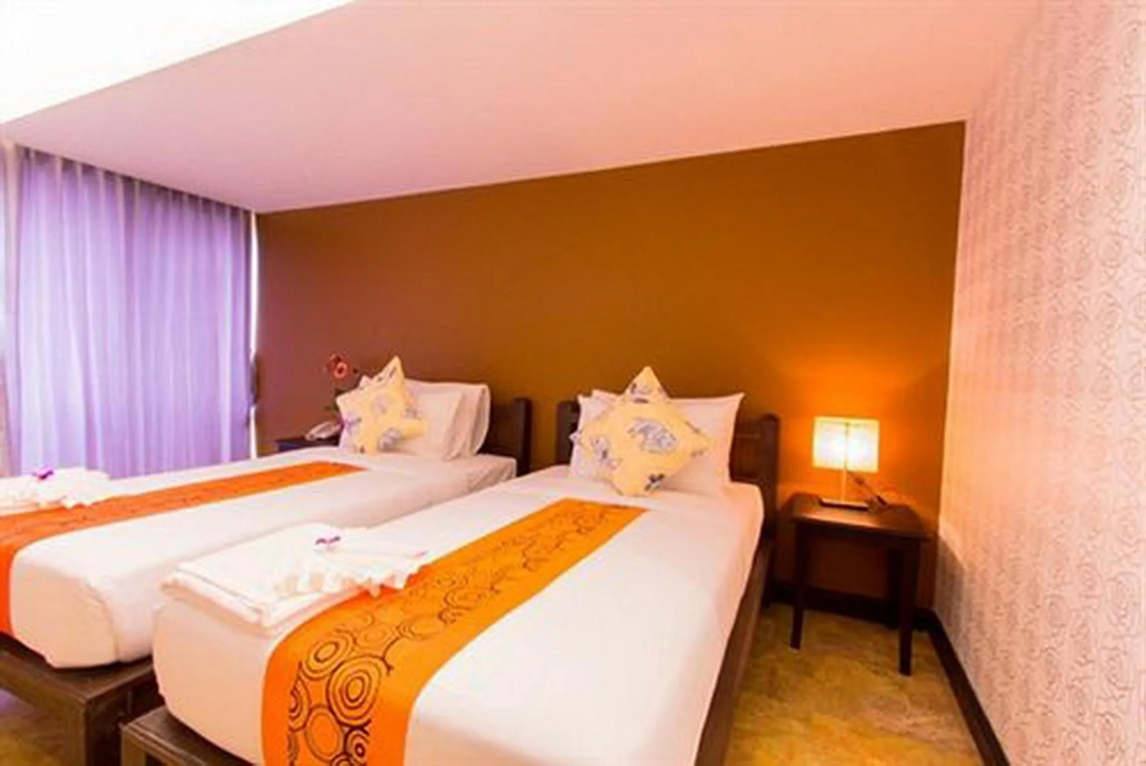 Bed in All Together Suite Hotel