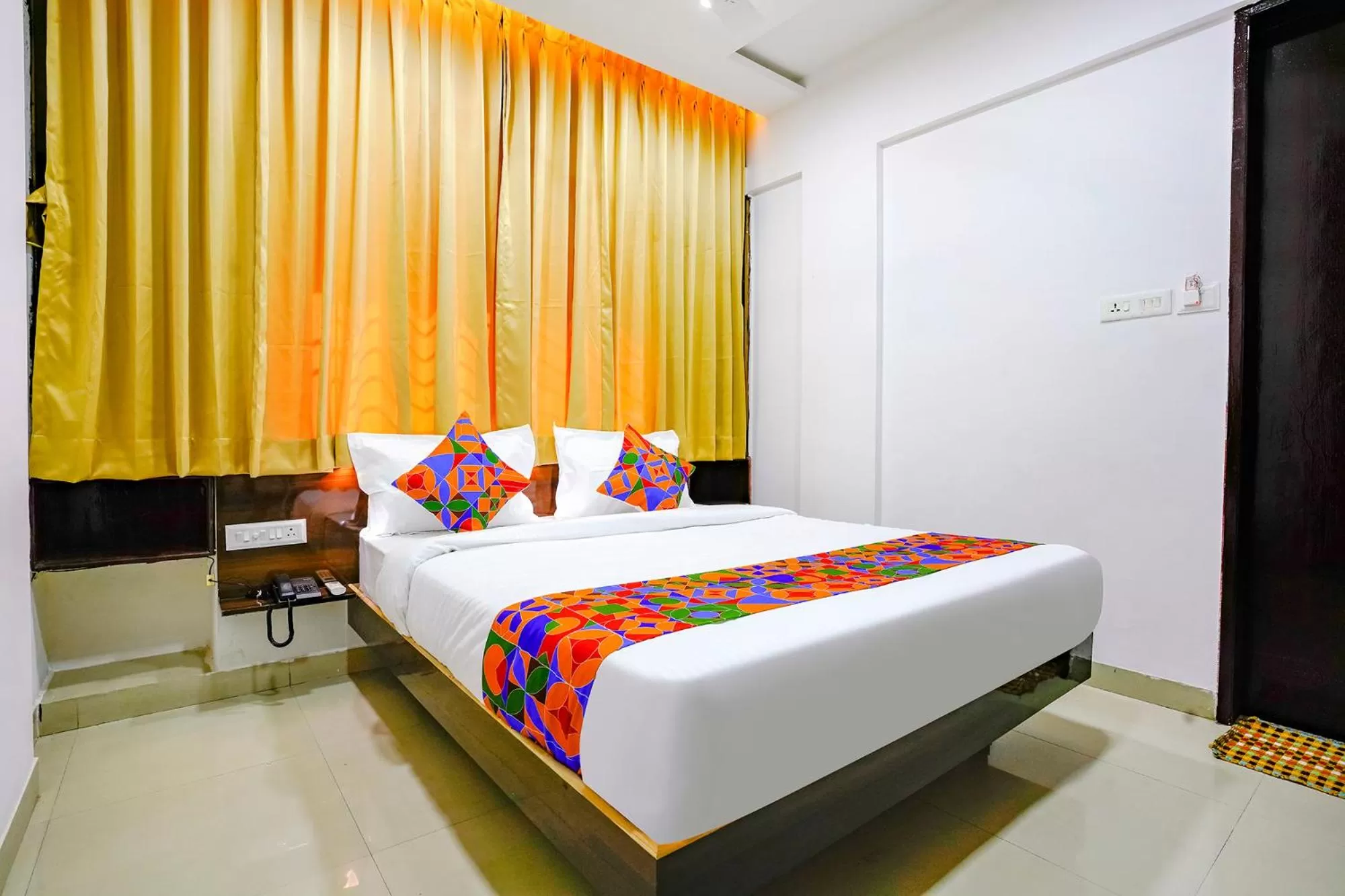 Bed in FabHotel Woods Regency