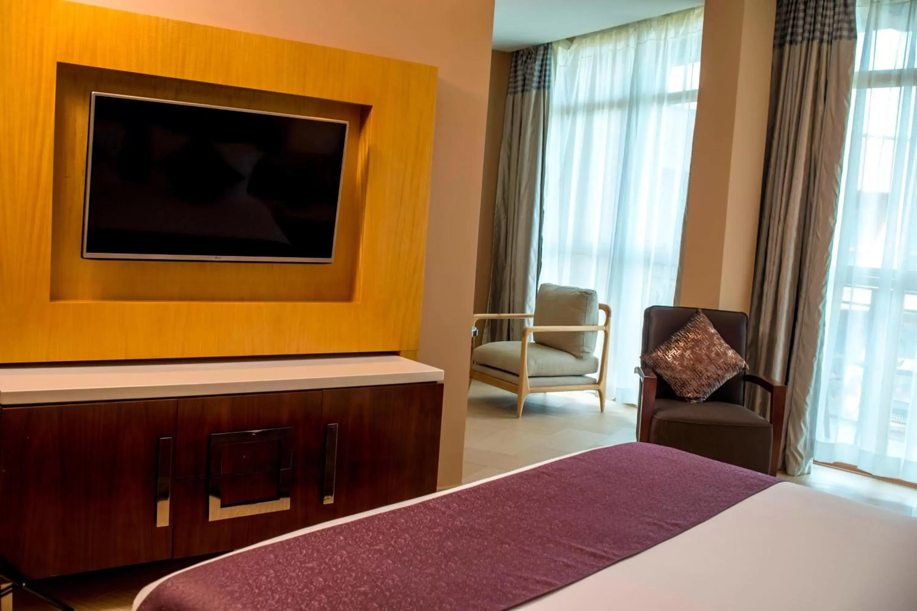 Photo of the whole room, TV/Entertainment Center in Protea Hotel by Marriott Entebbe