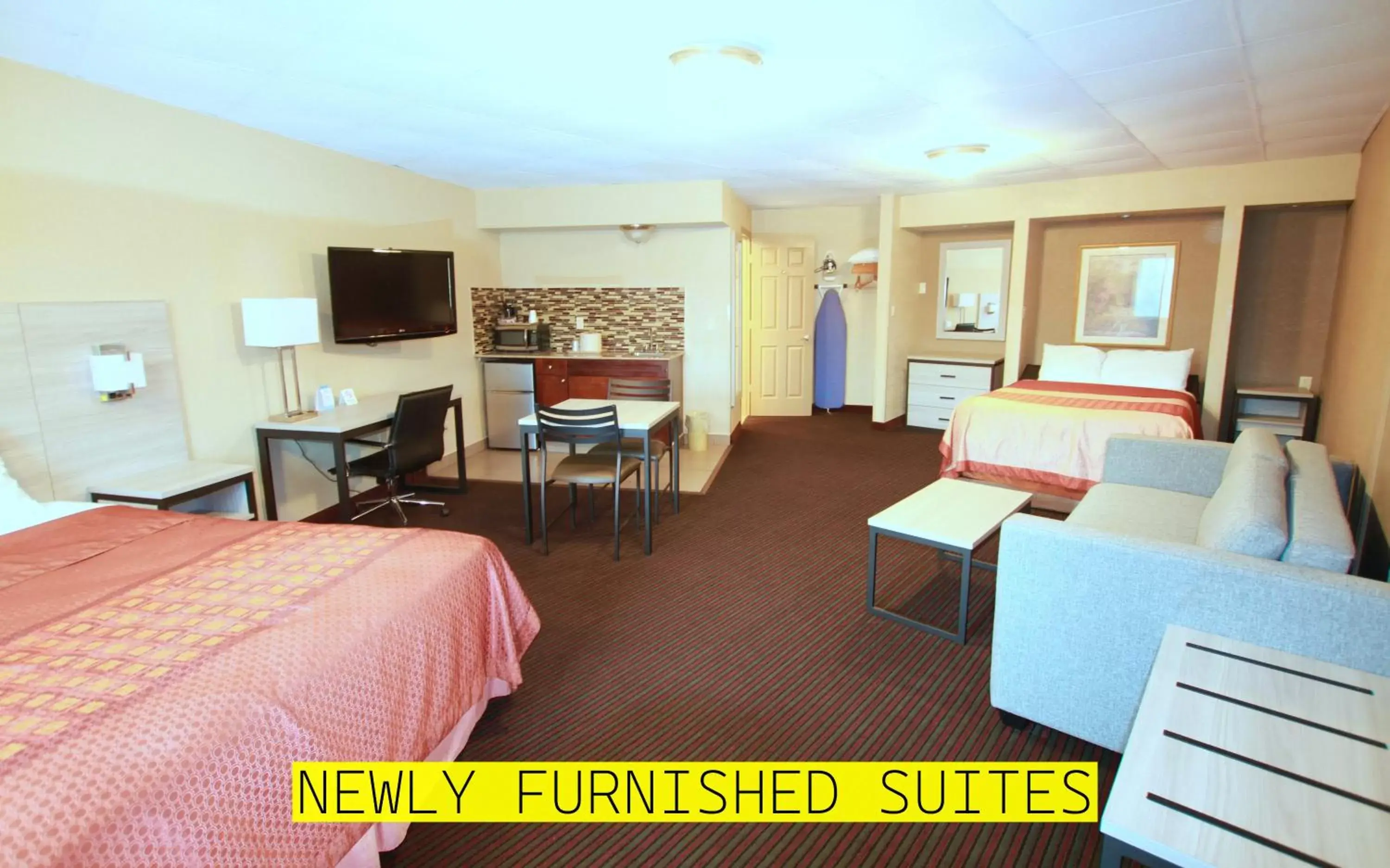 Bed, Seating Area in Travel Inn & Suites Flemington