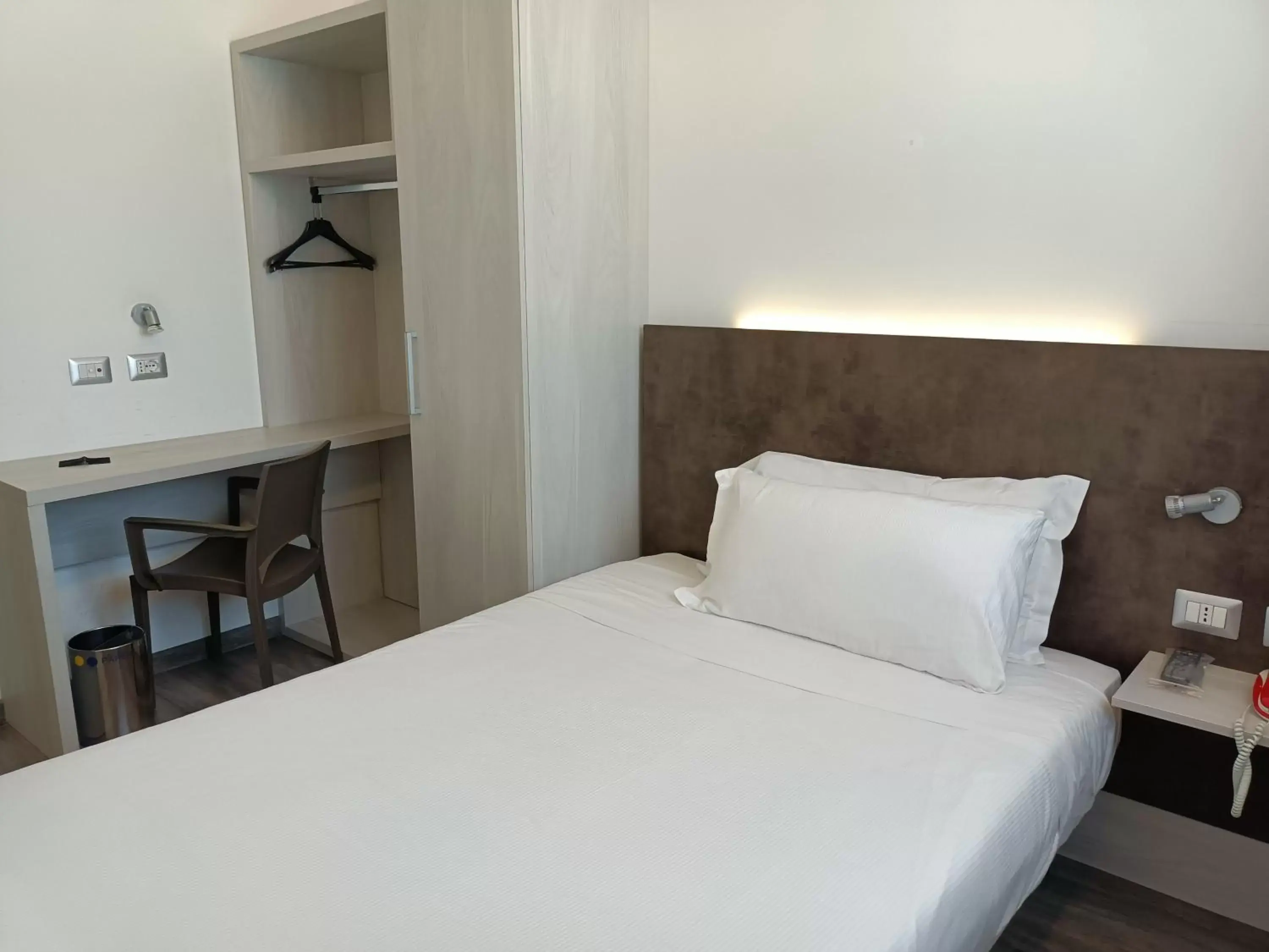 Bed in Phi Hotel Milano