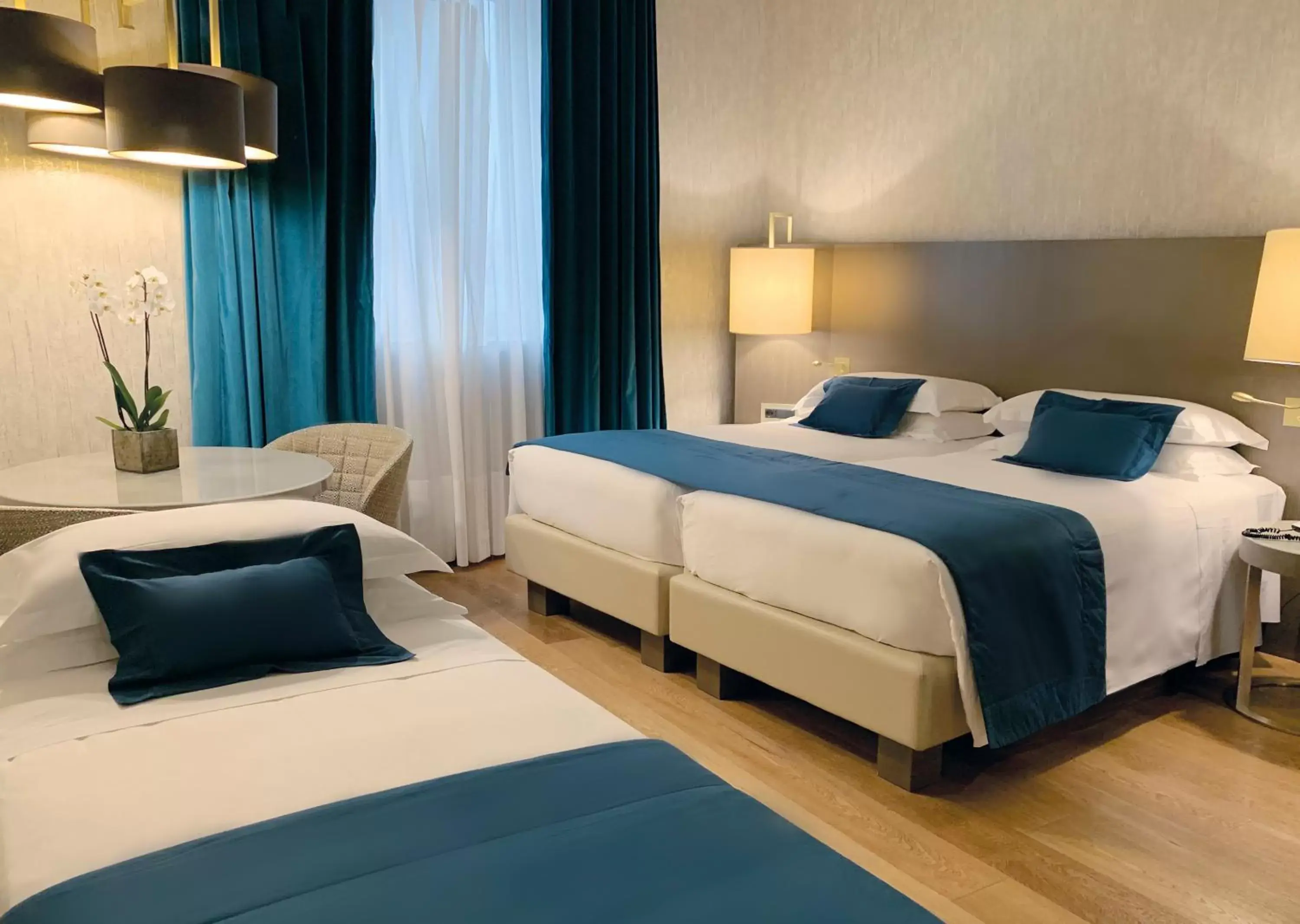 Family triple room in Rosa Grand Milano - Starhotels Collezione