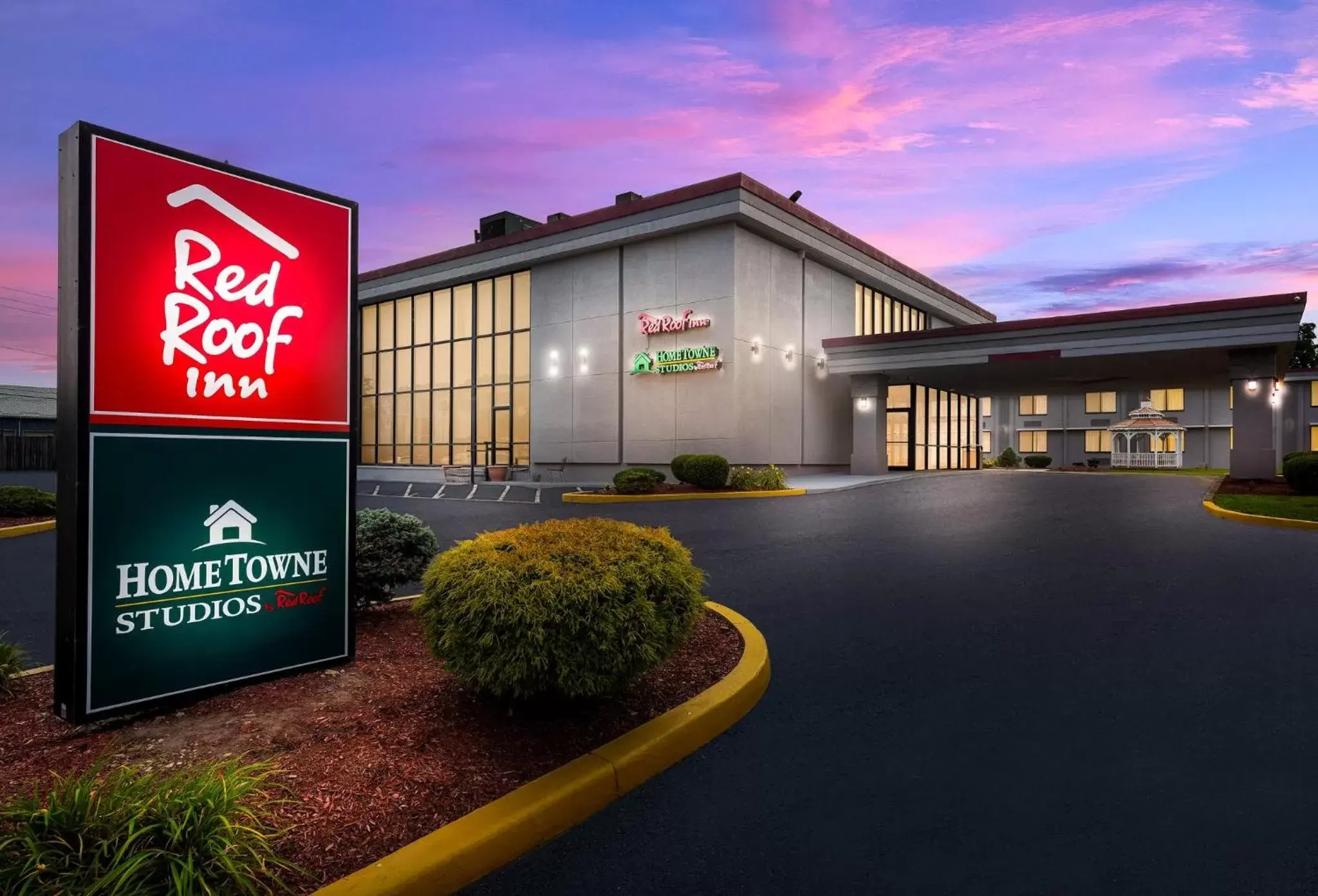 Property building in HomeTowne Studios by Red Roof Painted Post Property building in HomeTowne Studios by Red Roof Painted Post