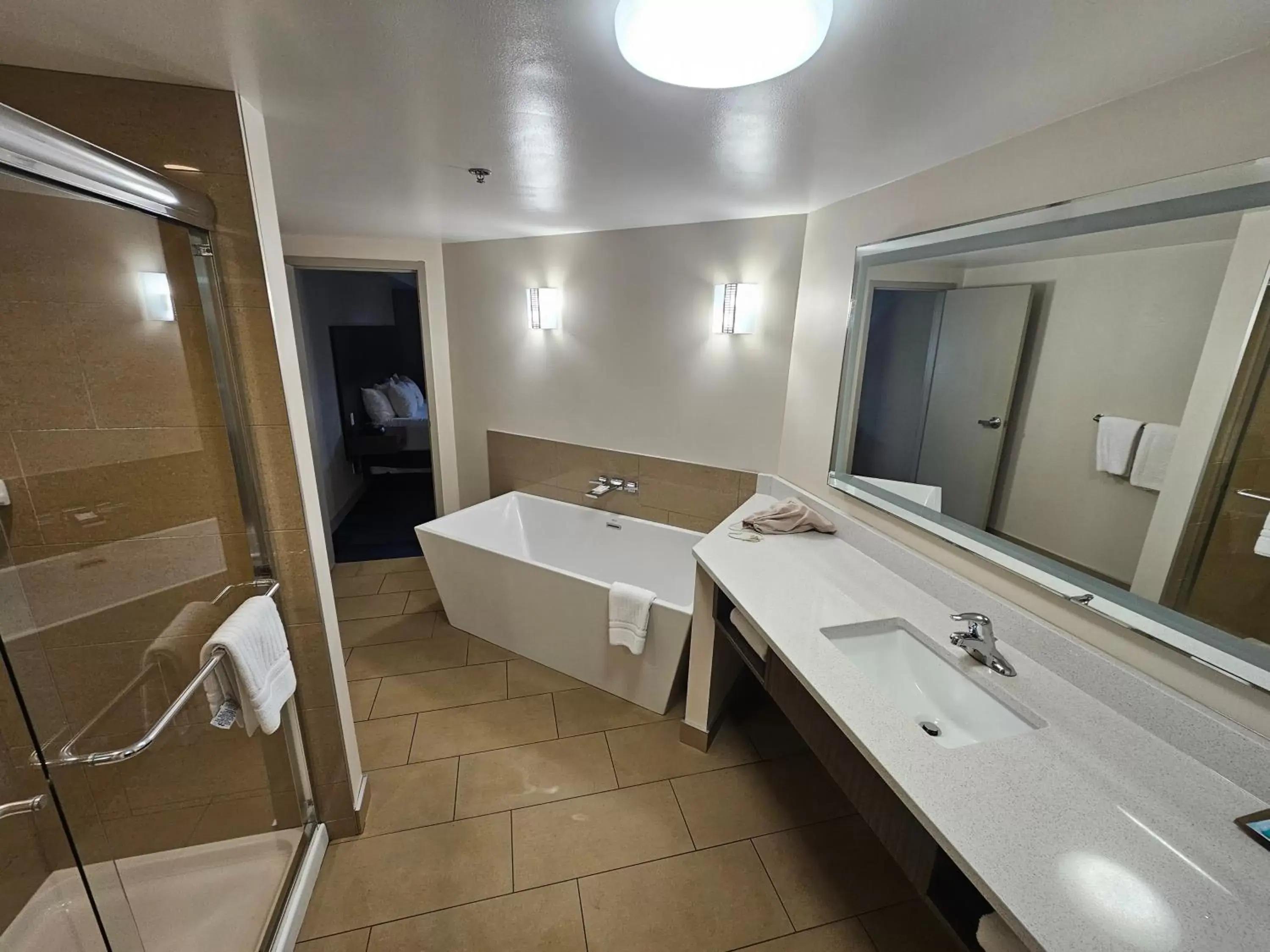 Bed, Bathroom in Clarion Hotel & Suites