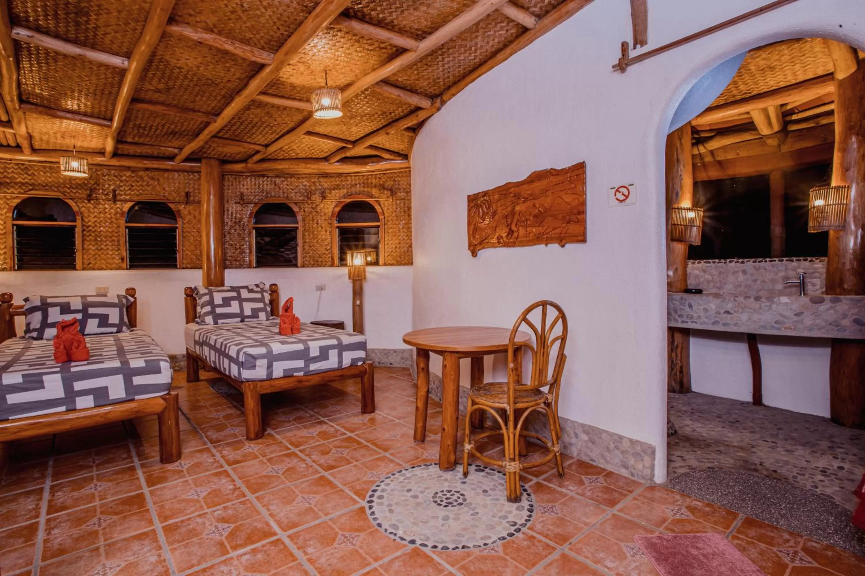 Bed in Atremaru Jungle Retreat