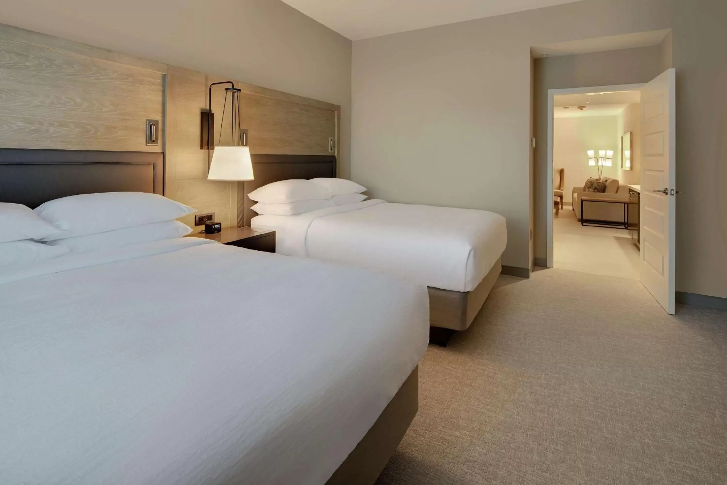 Living room, Bed in Embassy Suites St Augustine Beach Oceanfront Resort