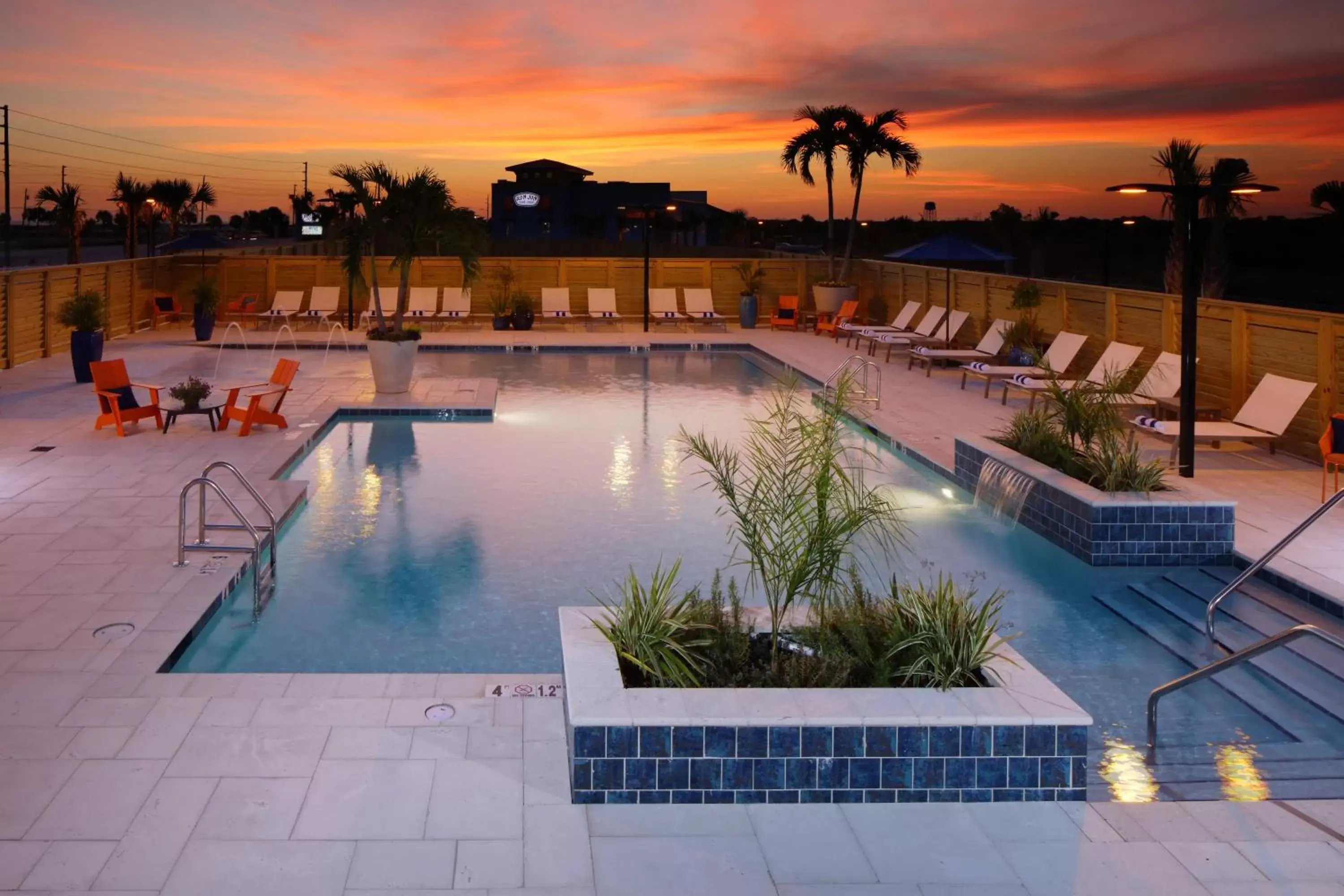 Property building, Swimming Pool in Hotel Indigo Orange Beach - Gulf Shores, an IHG Hotel
