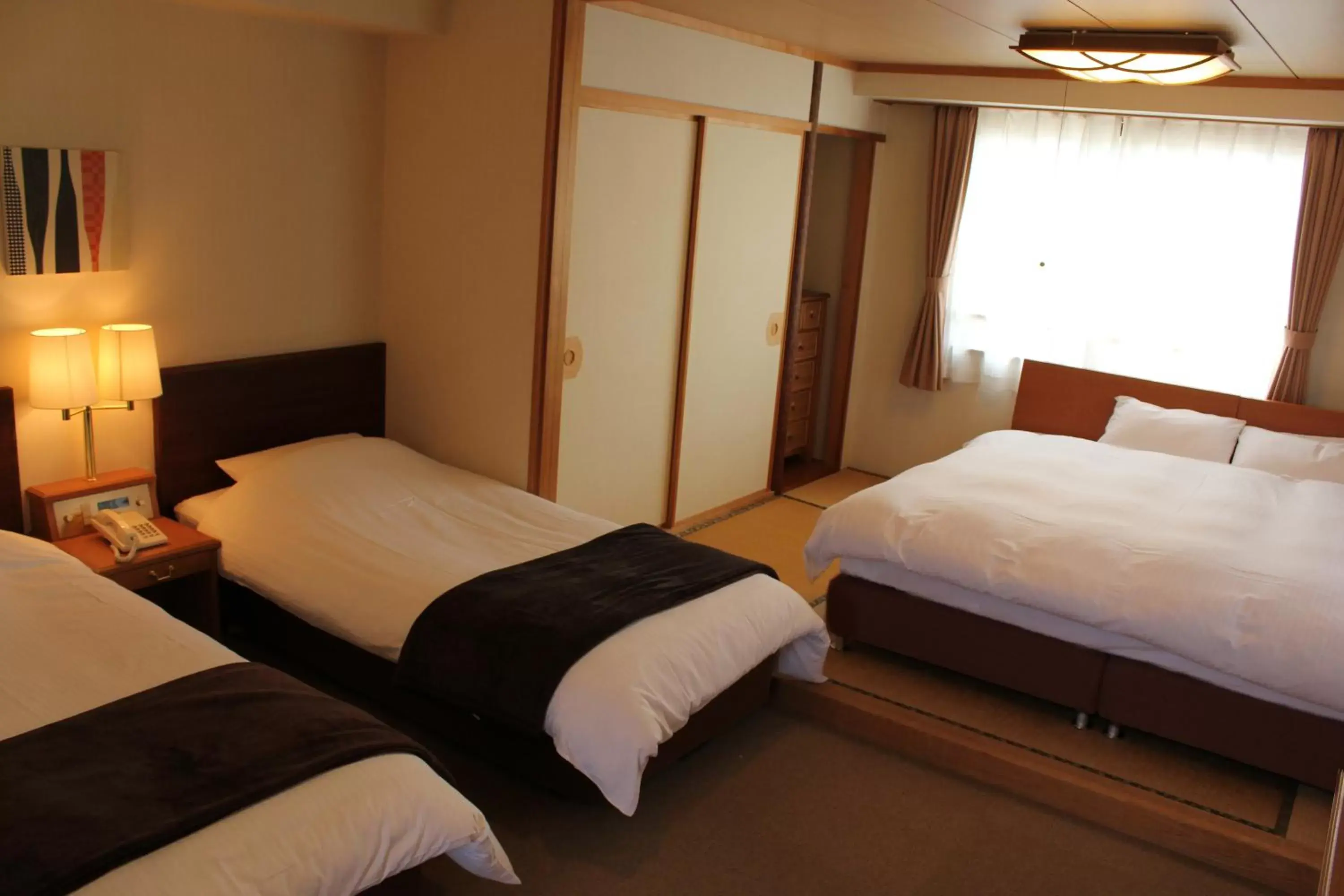 Bed in Hakuba Panorama Hotel