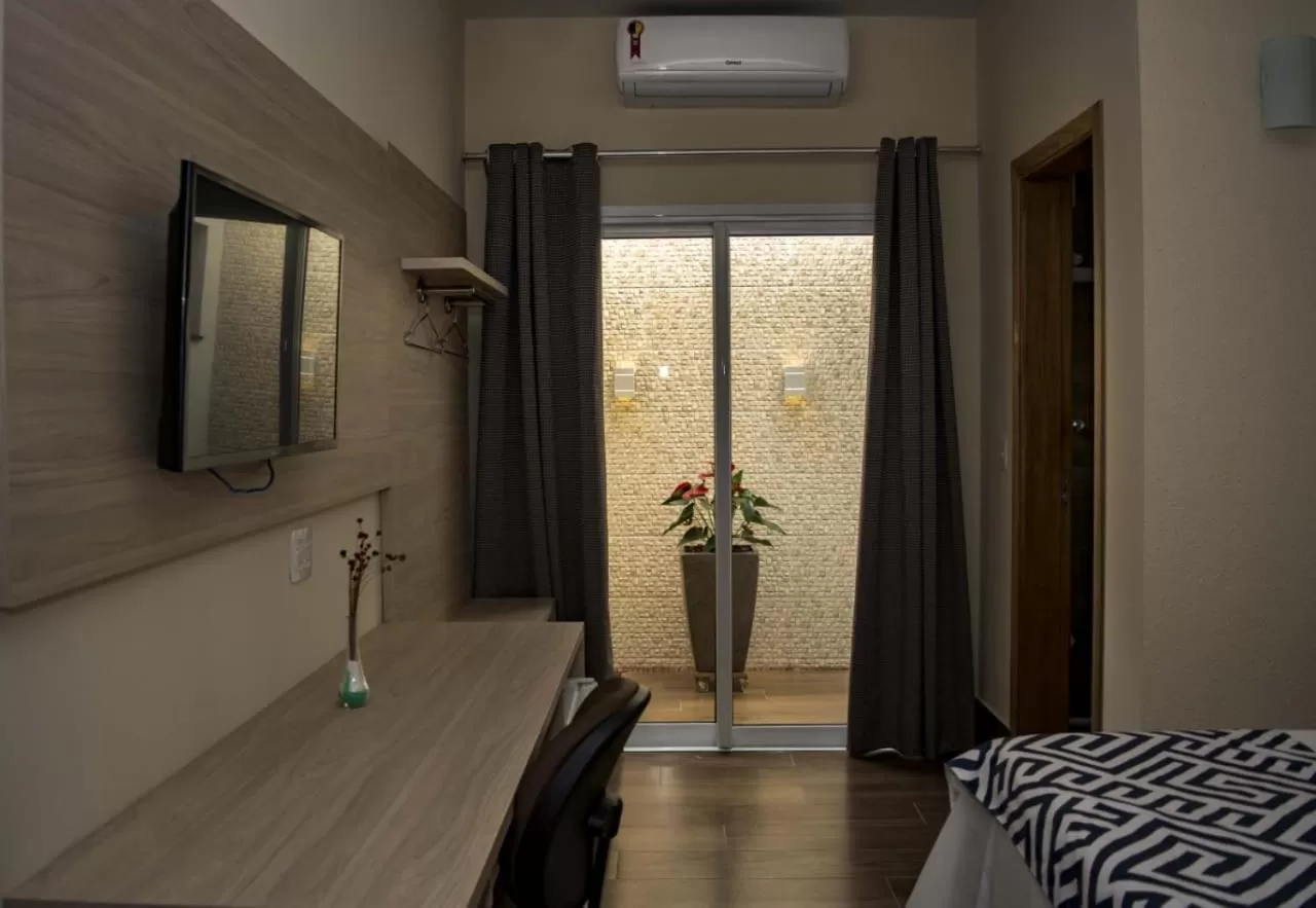 Bed in Pousada Araxá