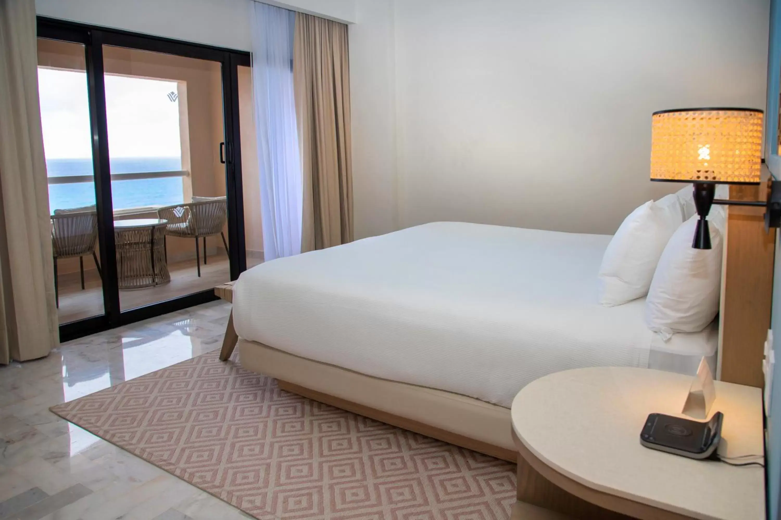 Bed in Wyndham Grand Cancun All Inclusive Resort & Villas