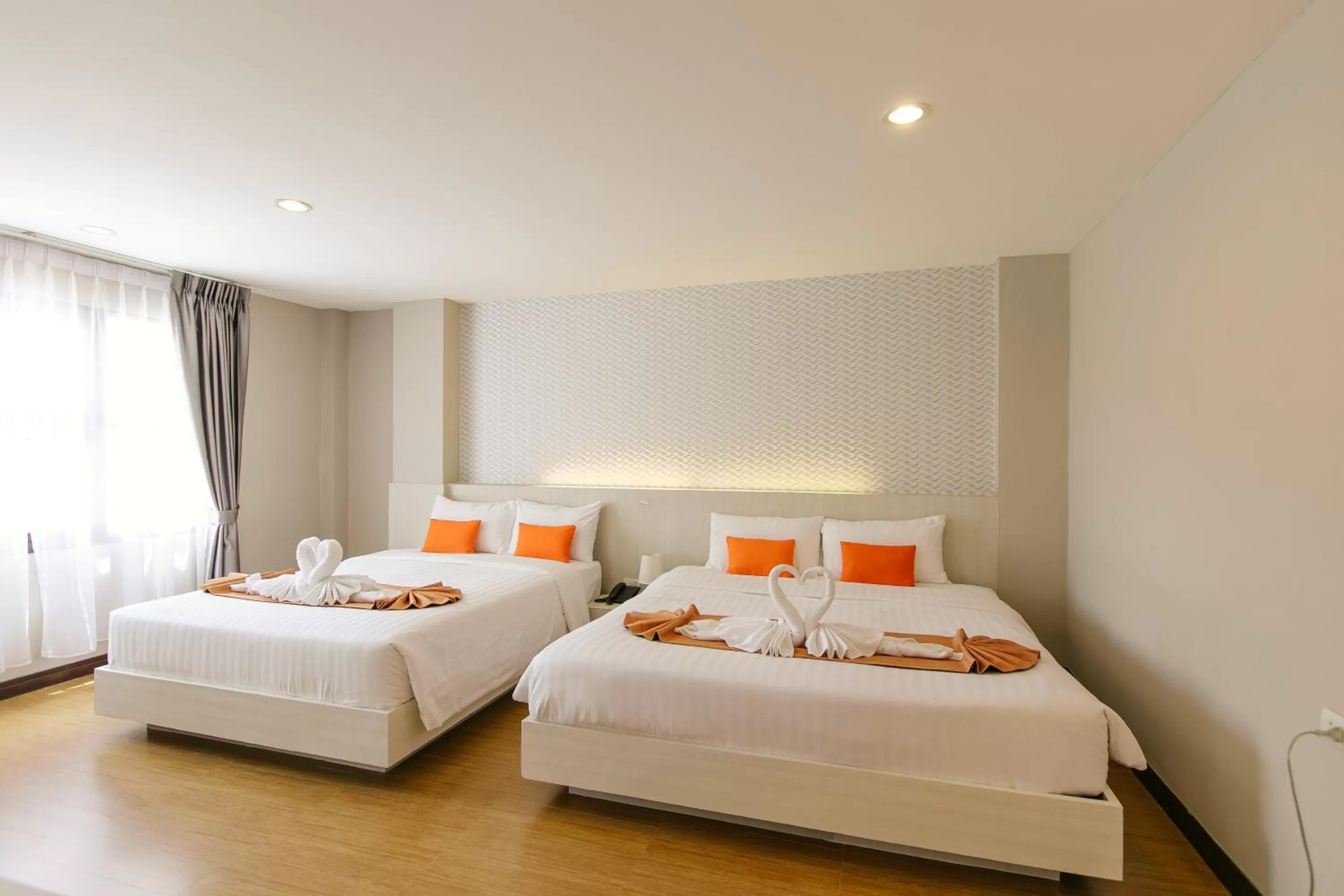 Bed in De Hug Hotel & Residence