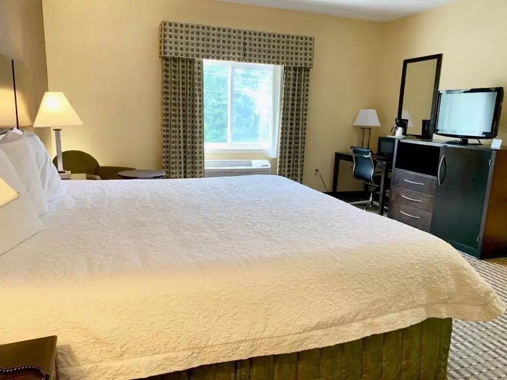 Bed in Whitney Inn & Suites Bed in Whitney Inn & Suites