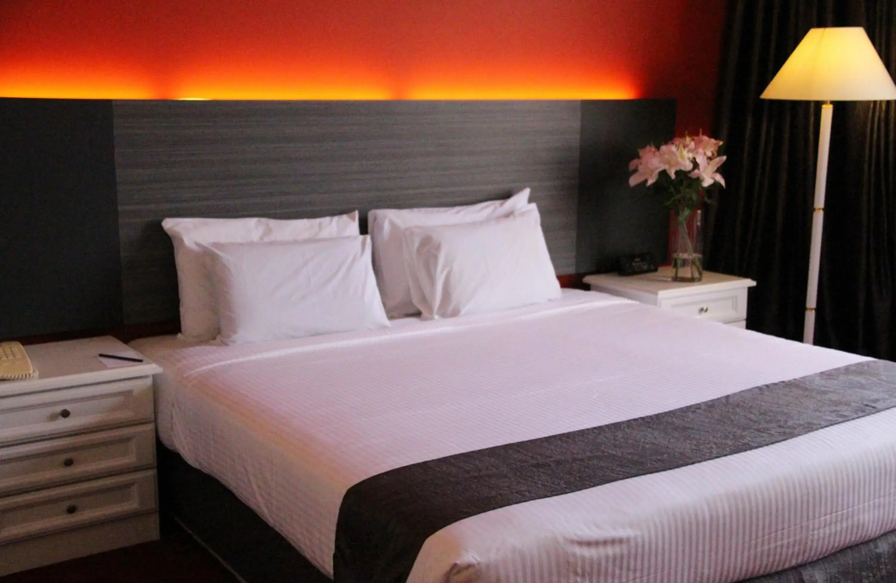 Bed in Grand Riverview Hotel